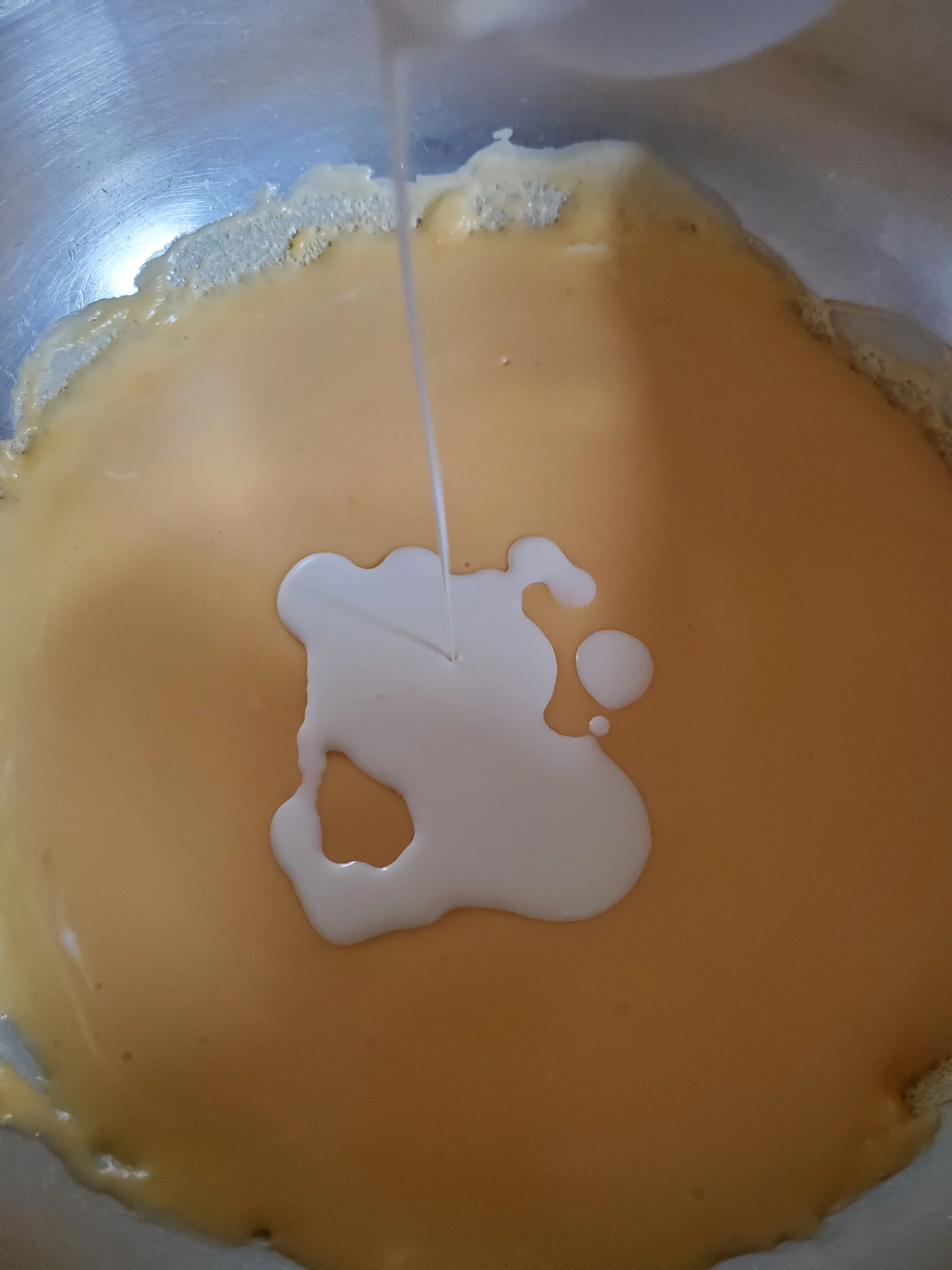  Adding cream to the beer cheese.  