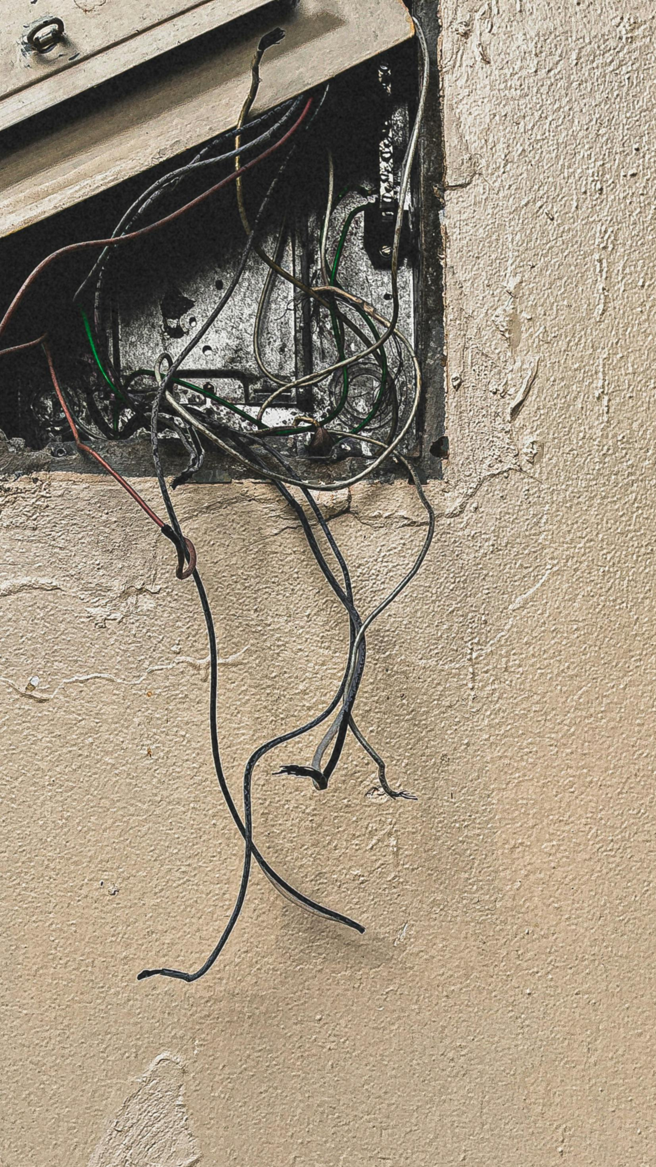 Damaged appliance cord showing a potential electrical safety hazard