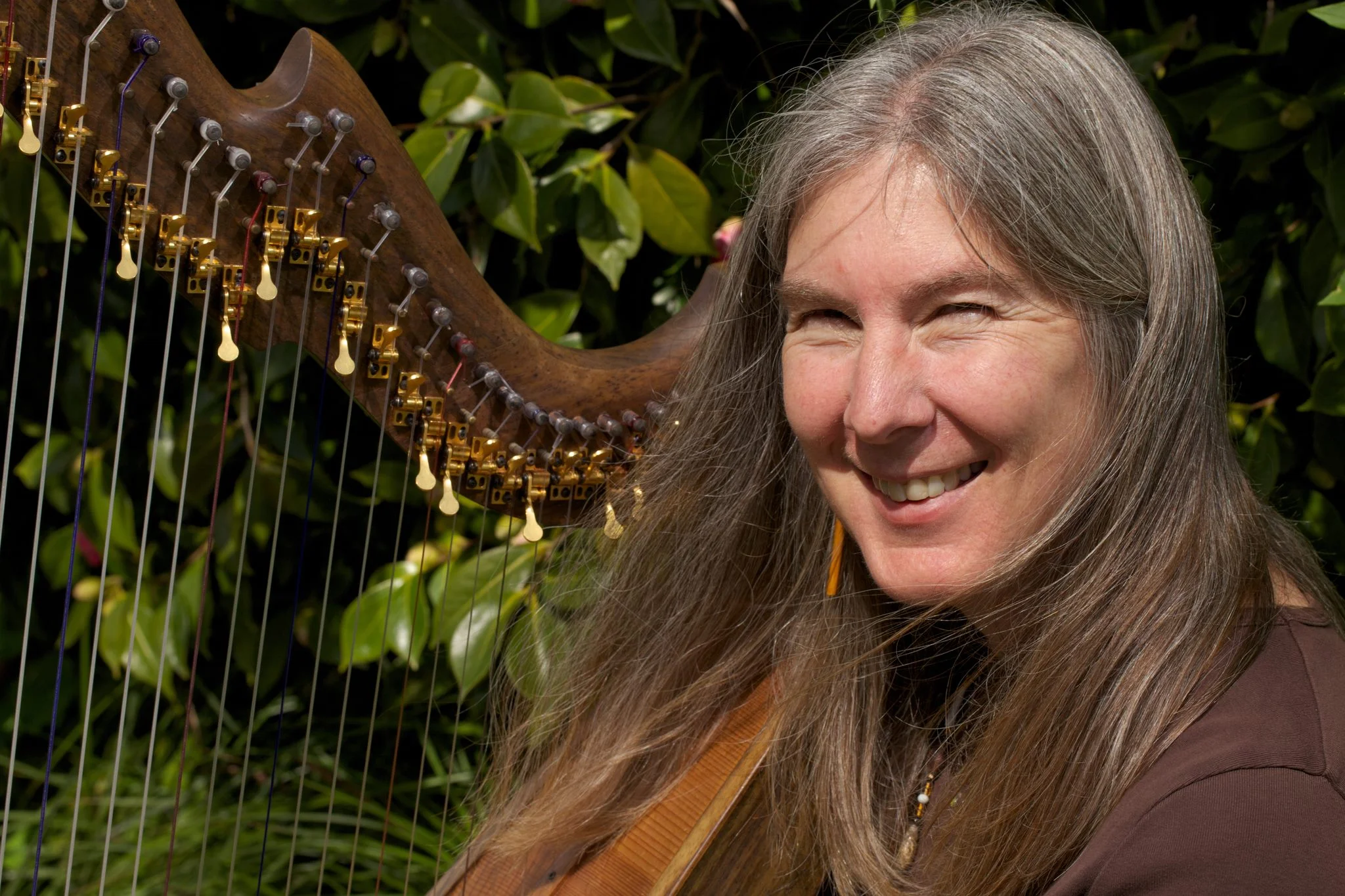 Shelley Phillips - harp, voice, celtic modes Shelley Phillips has a Masters of Music from the San Francisco Conservatory of Music. She plays and tours with The Anjali Quartet and The Coulter/Phillips Ensemble, performs as a duo with her husband, Barry Phillips, sings Shape Note music, and has collaborated with Rumi translator and poet Coleman Barks making two albums of poetry and music. Shelley has appeared on more than 20 albums on the Gourd music label, including her solo albums The Fairie Round, Pavane, The Butterfly, and The Wood Between the Worlds, as well as a duet album with Barry called Wondrous Love. She also has recorded music of the Shakers and produced a benefit album, Verdant Groves, for the Shaker village museums. In addition she teaches at several other summer programs, including founding the Boxwood Flute Festival's children's, teens' and seniors' programs in Nova Scotia and teaching music related crafts at various primitive skills gatherings in the west. Shelley also works as a music director within the Episcopalian church and is the founder and Artistic director of Community Music School of Santa Cruz , where she runs Celtic Camps for children, teens and adults, concerts, workshops, and other programs. She lives on the foggy California coast with her husband and her very spoiled cat.