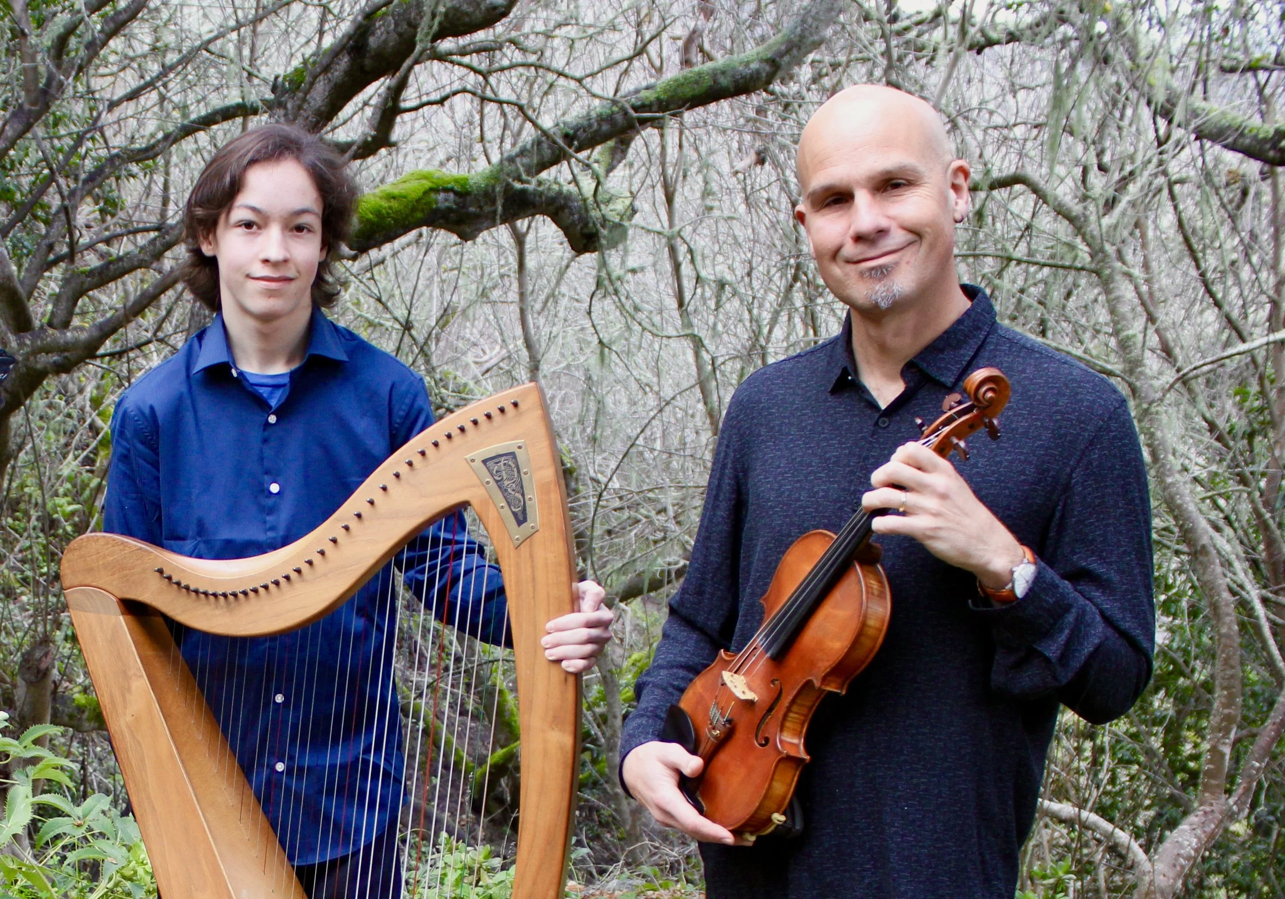 photo of Evan Weed holding a harp, and John Weed holding a fiddle