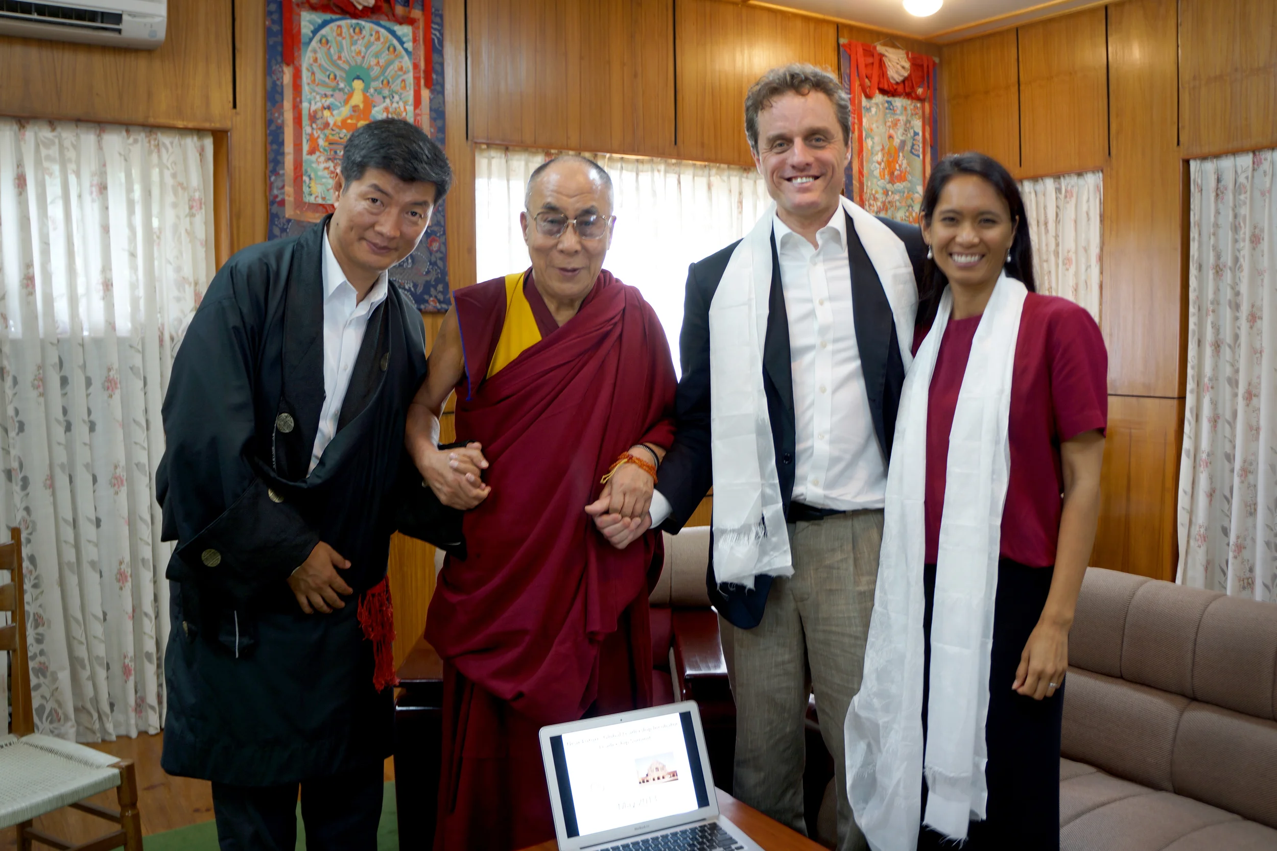 Sikyong Lobsang Sangay (left), His Holiness the Dalia Lama (center left), Dr. Michael McCullough (center right), and Ana Rowena McCullough (right) stand for a picture