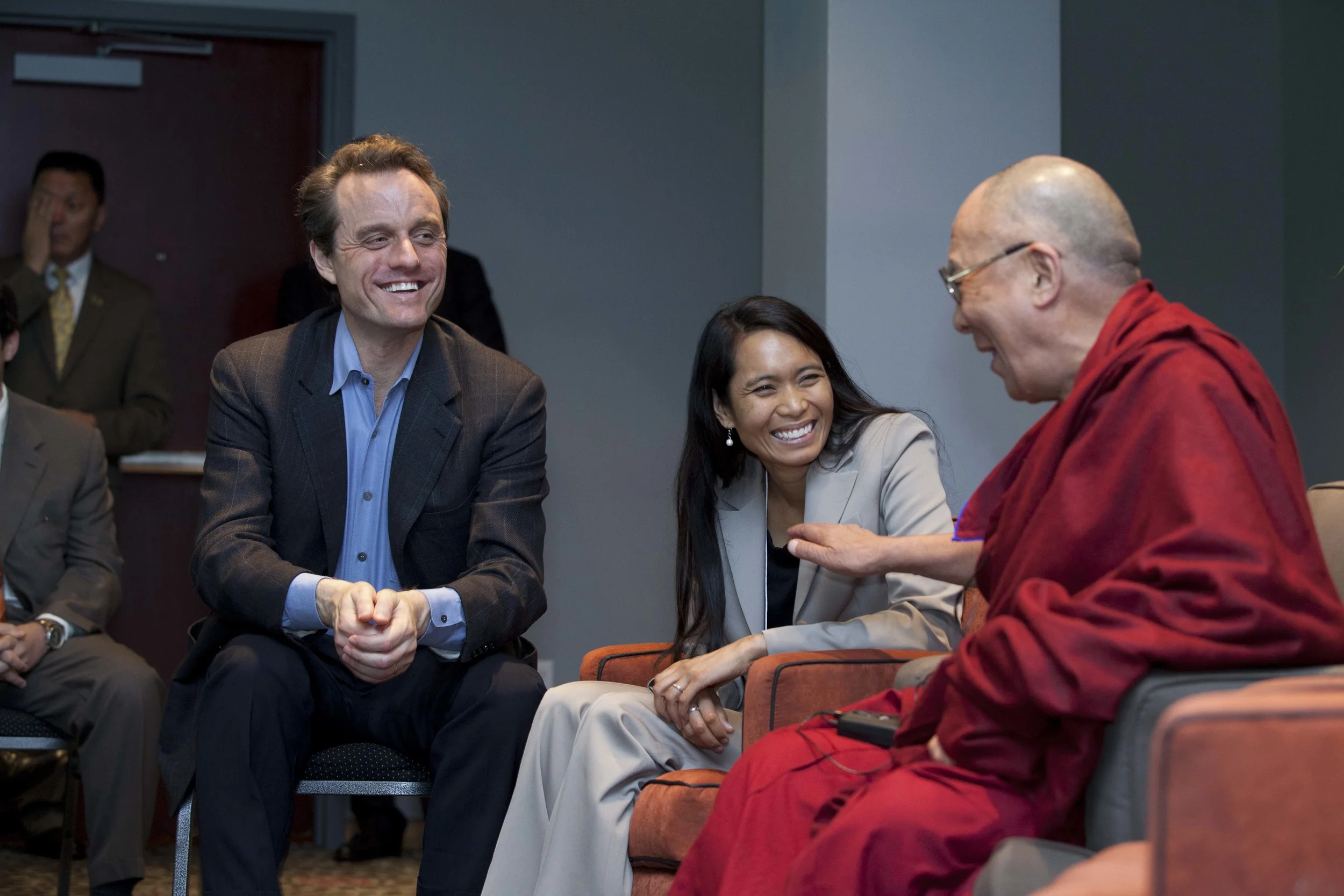 Dr. Michael McCullough (left) and Ana Rowena McCullough (center) conversing with His Holiness the Dalai Lama (right)