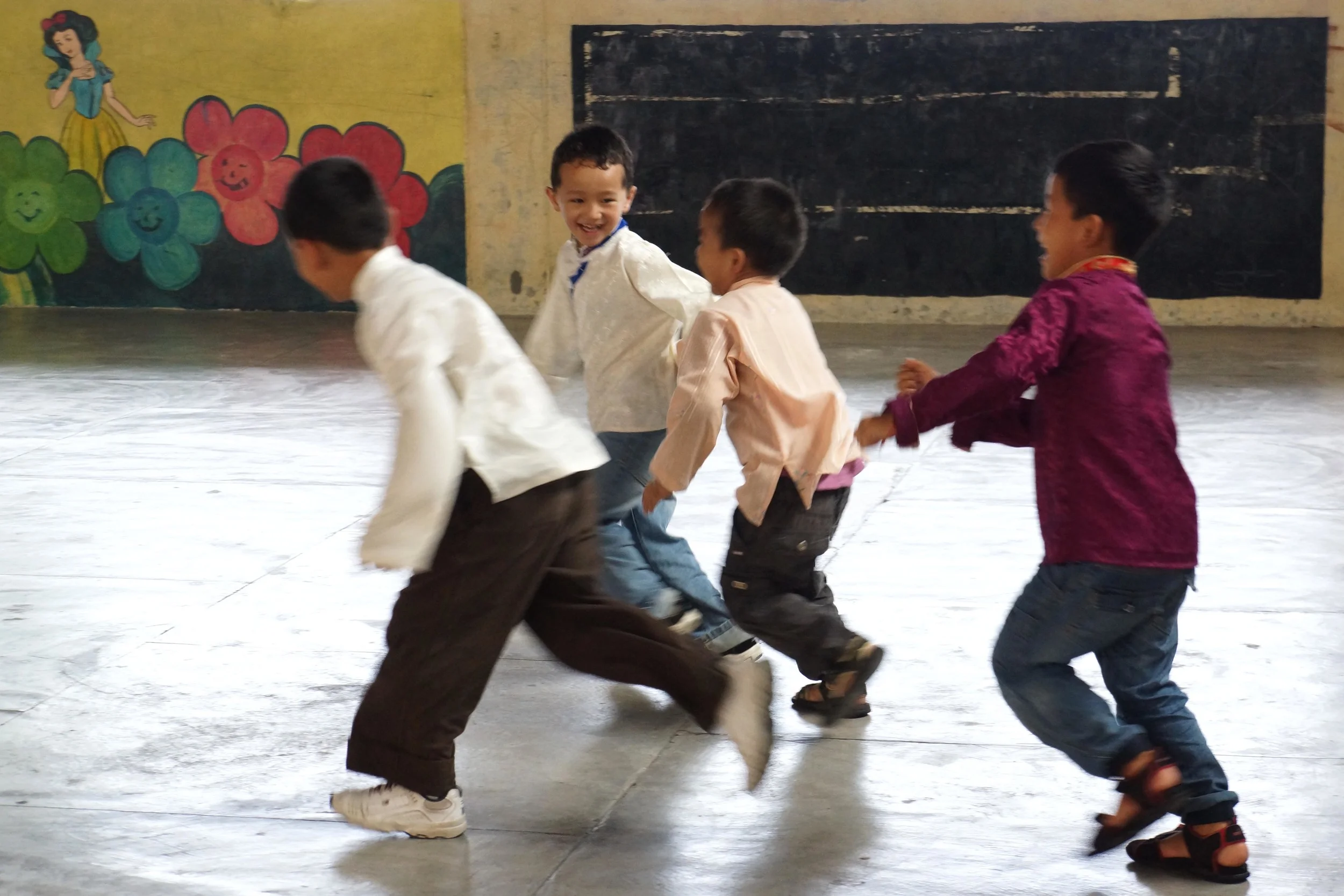 Tibetan children running and playing