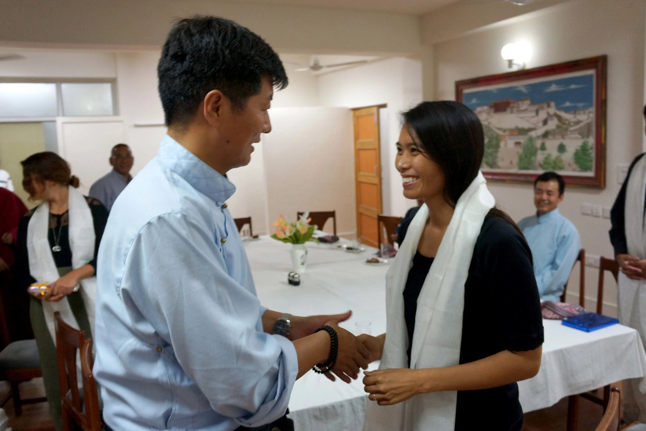Sikyong Lobsang Sangay (left) greeting Ana Rowena McCullough (right)