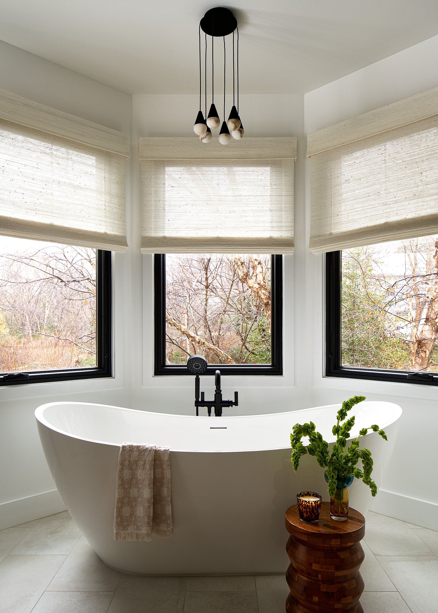 Primary bathroom with a freestanding tub and matte black fixtures, interior design photography in the DMV area