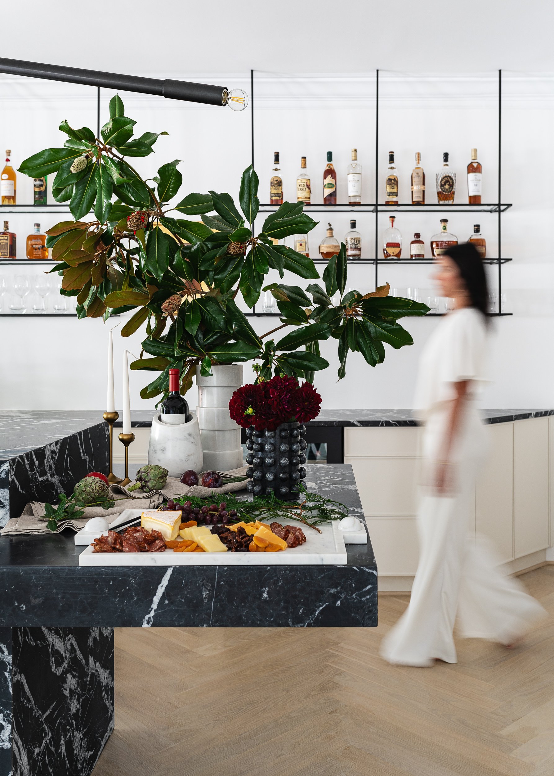 Marble kitchen island styled with a charcuterie board, lifestyle interior photography in the DMV area