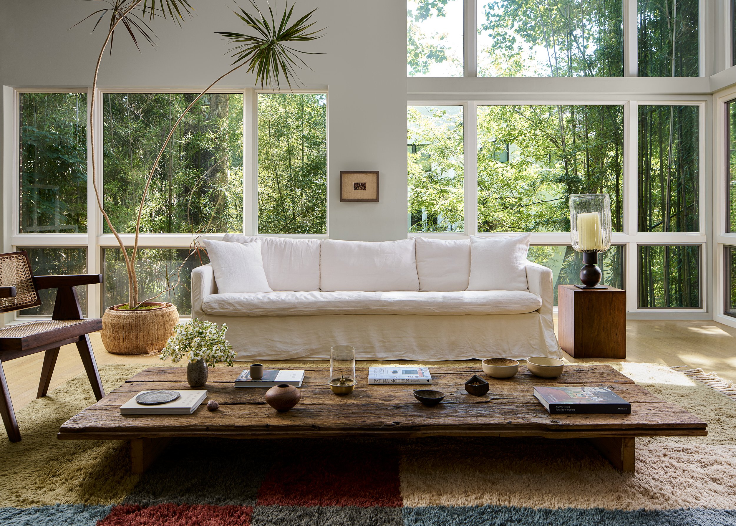 Living room with floor-to-ceiling windows and a white sofa, interior design photography in Northern Virginia