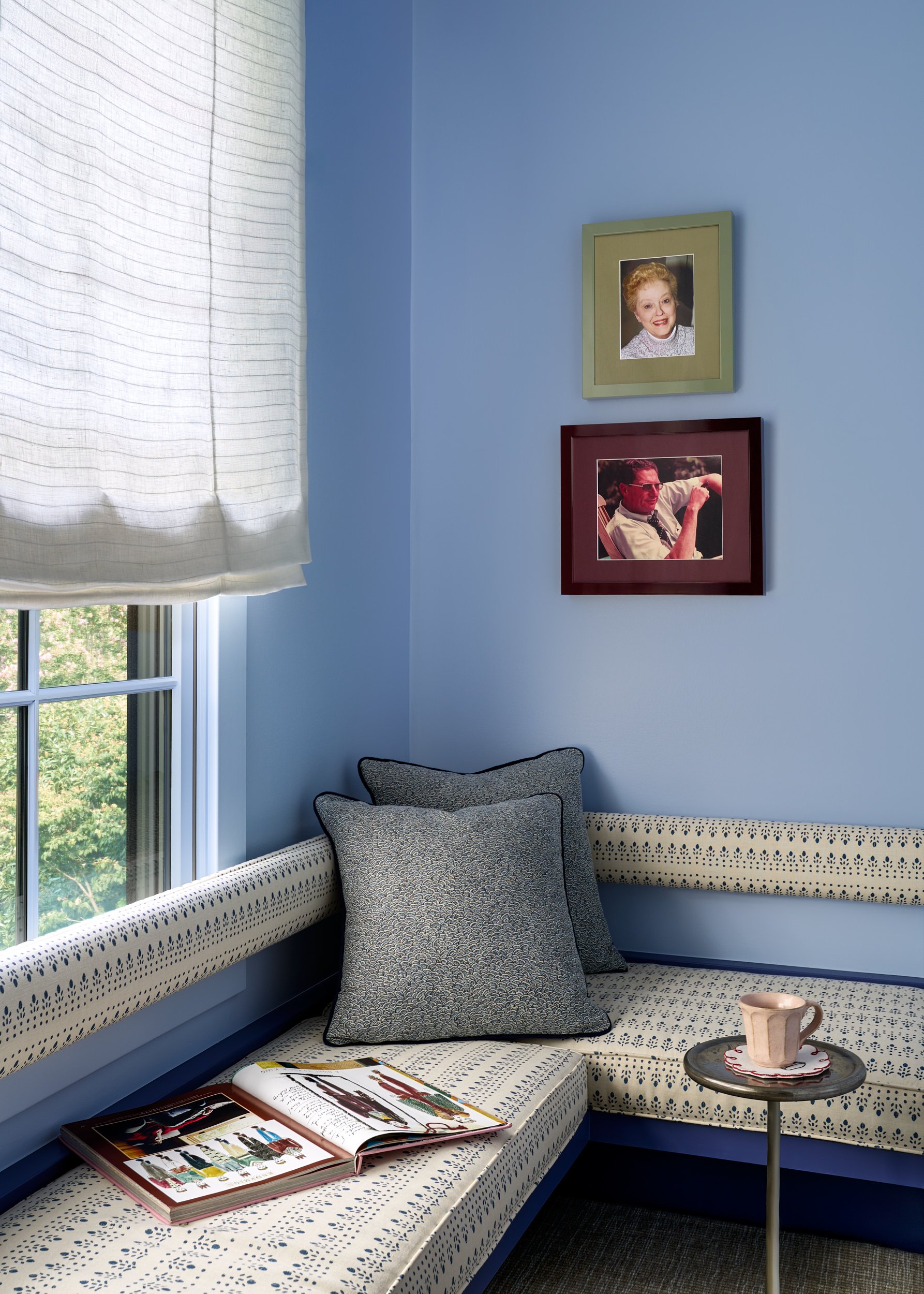 Blue built-in window seat and cozy reading nook, interior design photography in Northern Virginia