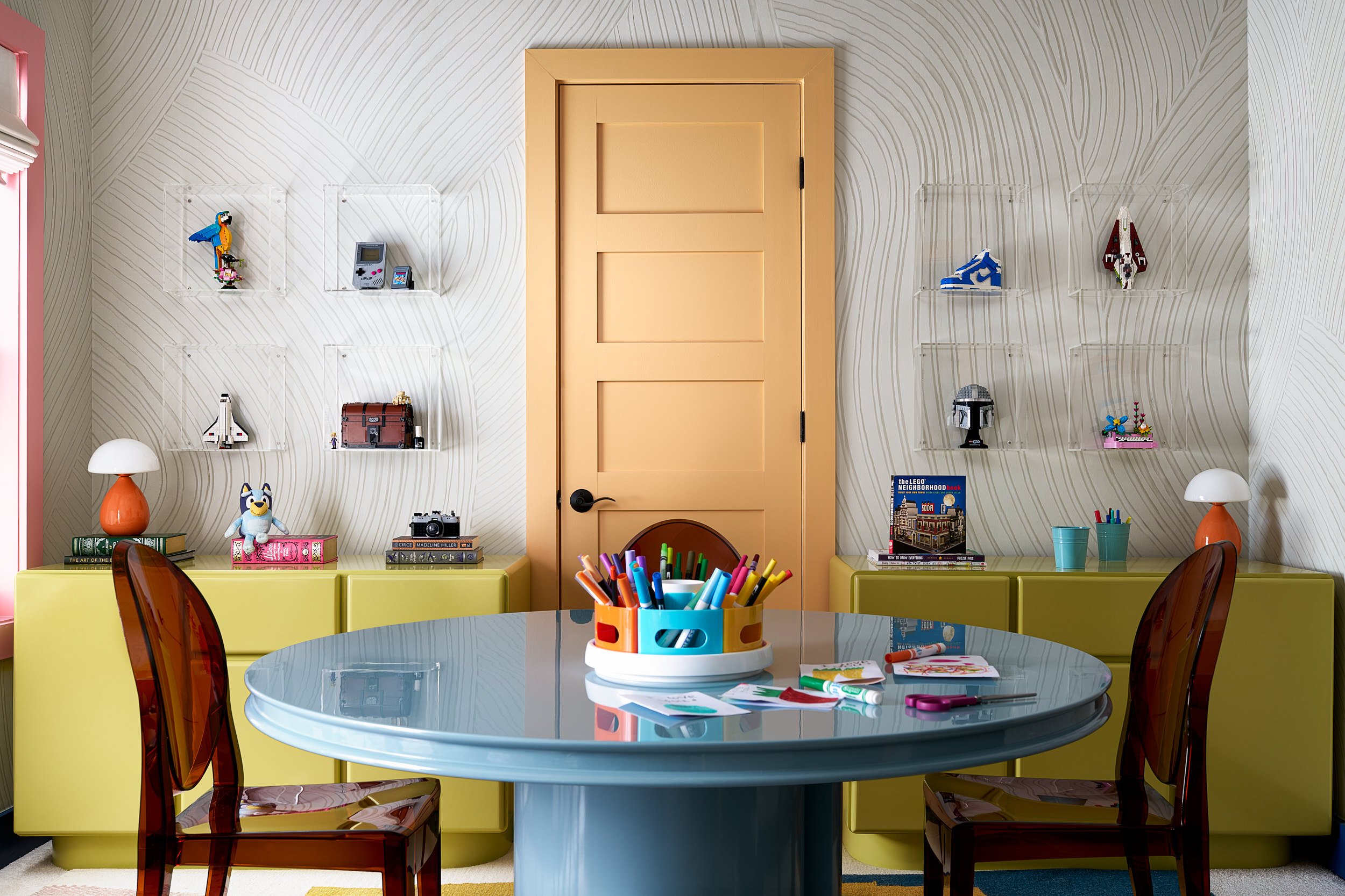 Kids' room with colorful wallpaper and an orange door, interior design photography in Washington, DC