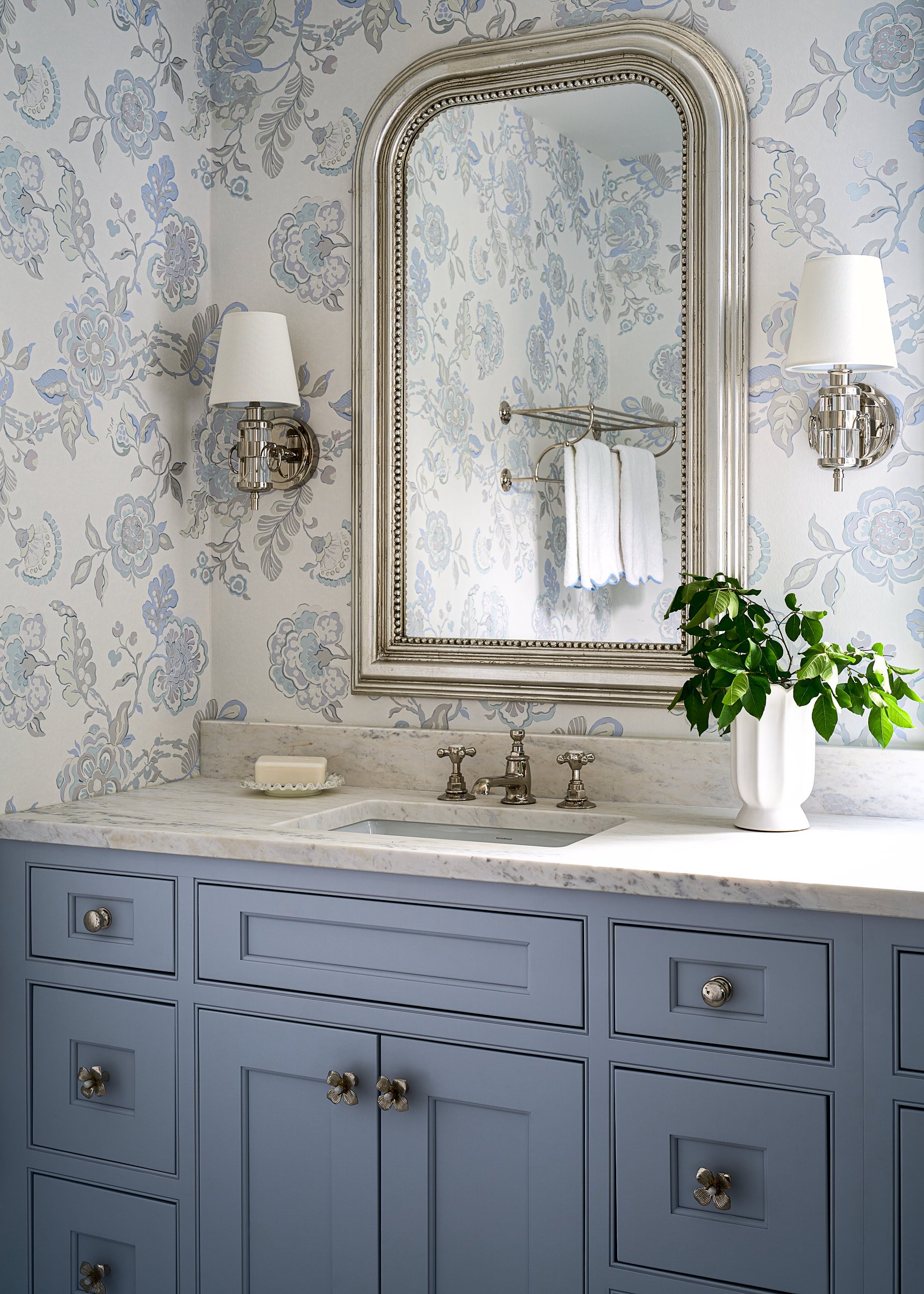 Bathroom with blue floral wallpaper and a silver mirror, interior design photography in Northern Virginia