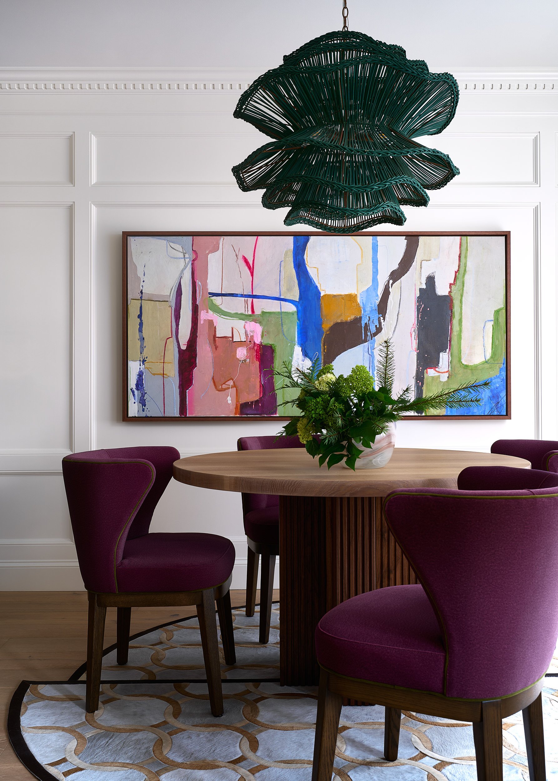 Dining room with purple velvet chairs and a scalloped pendant light, interior design photography in Northern Virginia