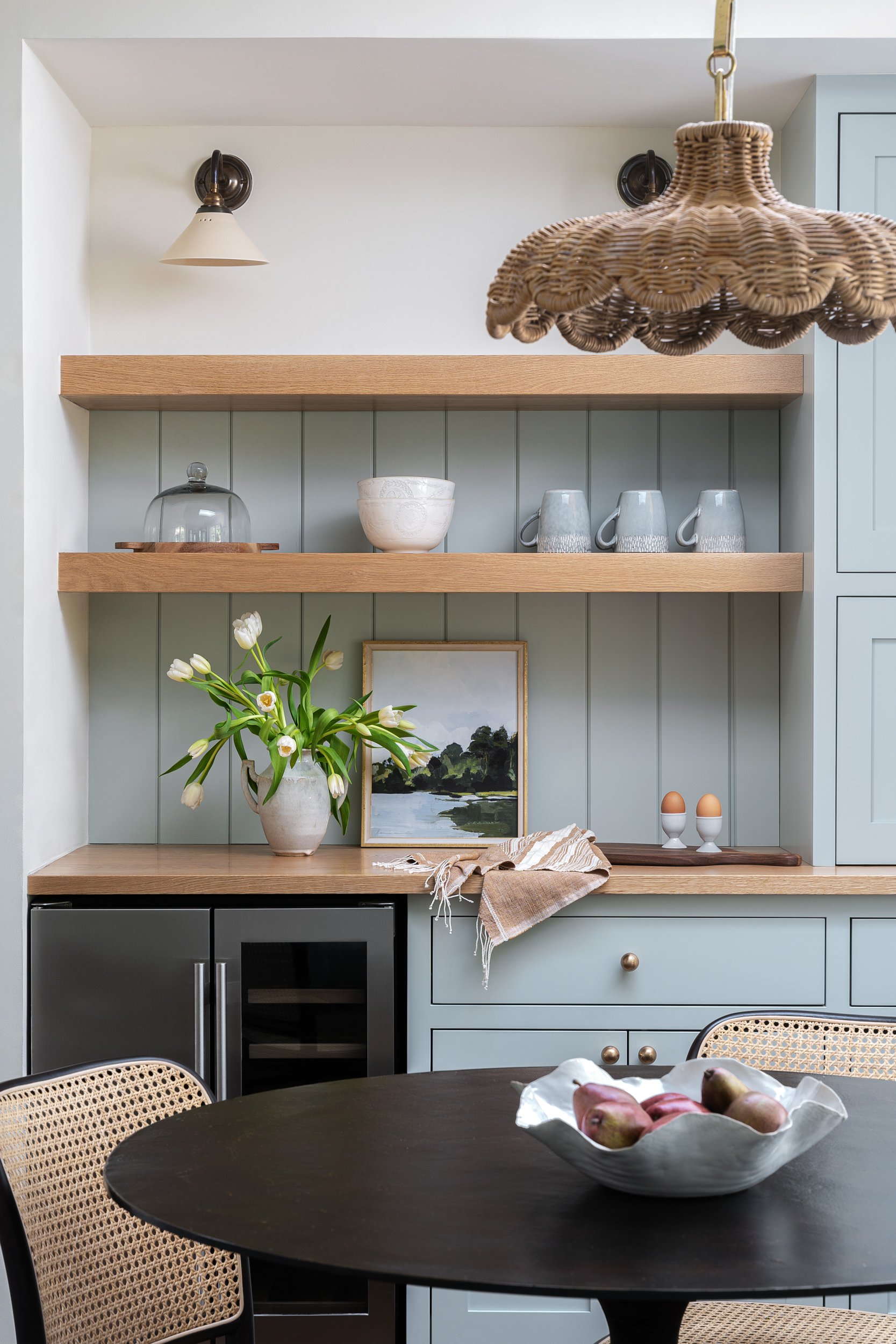 Kitchen nook with sage green shelving and a built-in wine fridge, interior design photography in Maryland