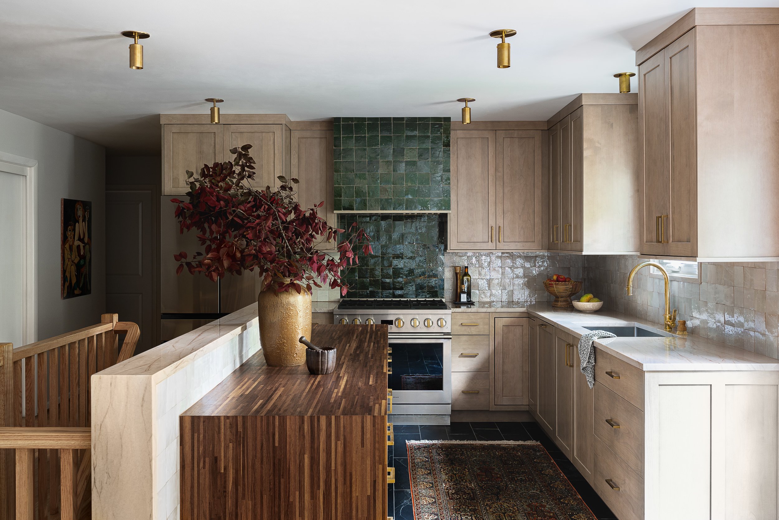 Kitchen with a green tile range hood and wood countertop island, interior design photography in Maryland