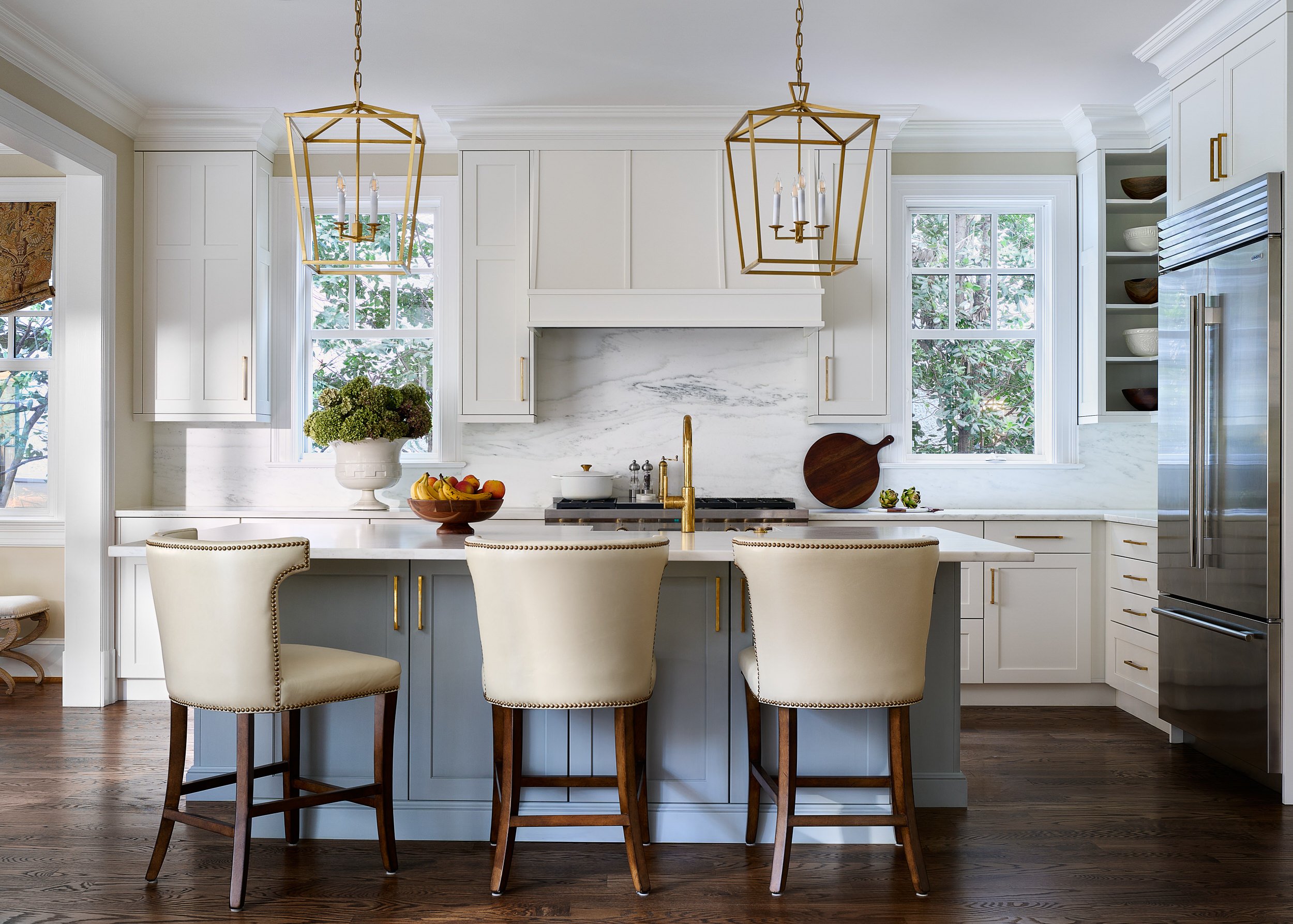 Kitchen with lantern pendant lighting and white cabinetry, interior design photography in Maryland