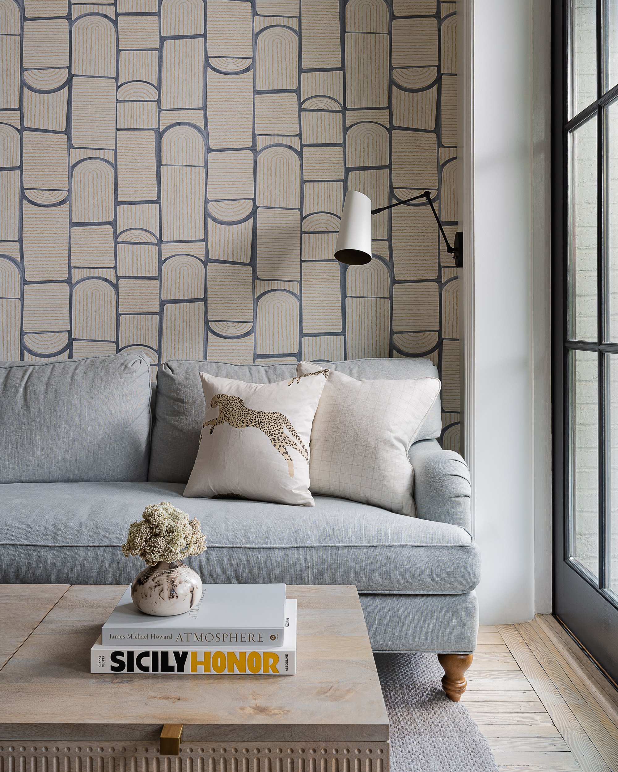 Living room with arch-pattern wallpaper and a gray sofa, interior design photography in Washington, DC