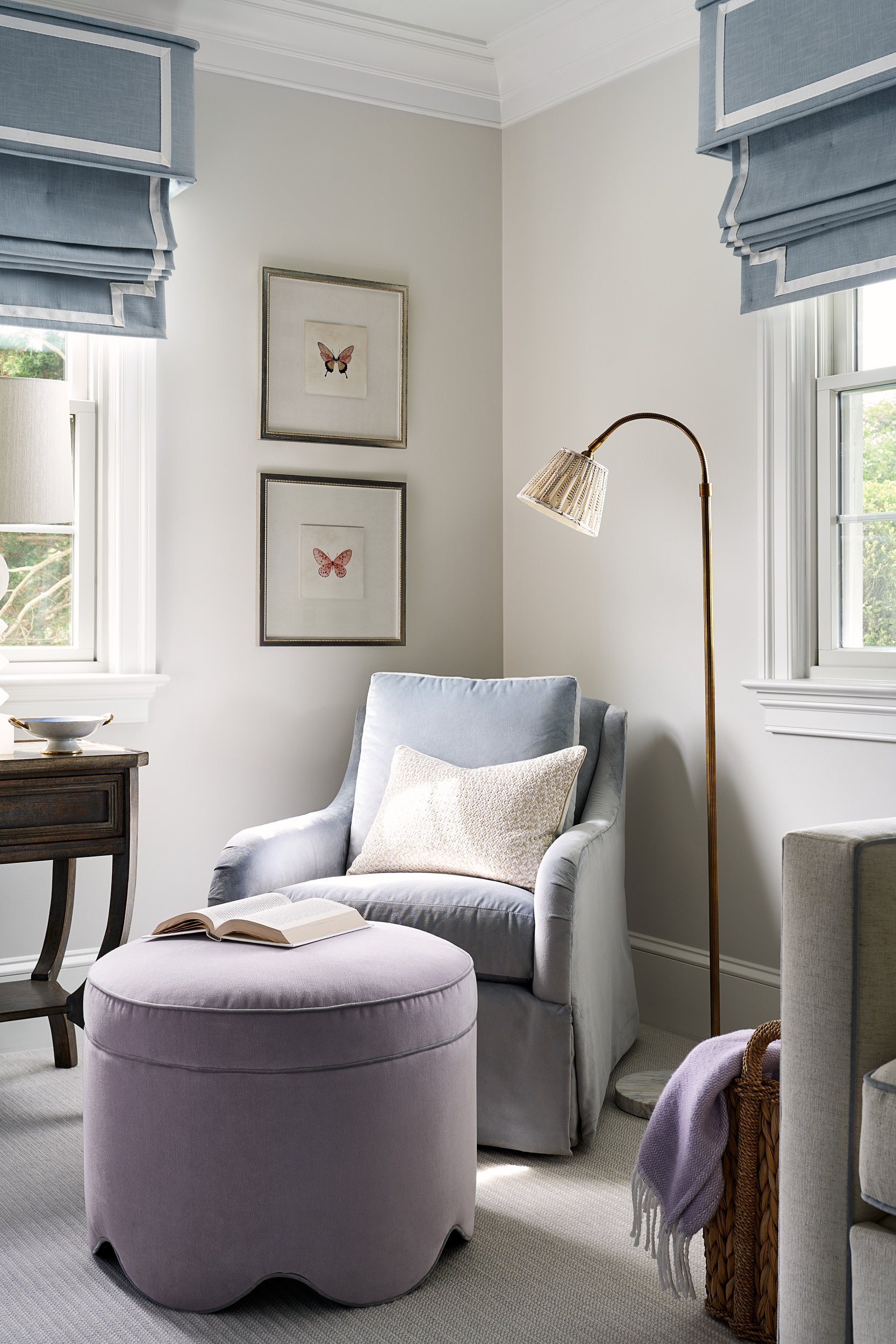 Sitting room corner with a blue armchair and lavender ottoman, interior design photography in Maryland