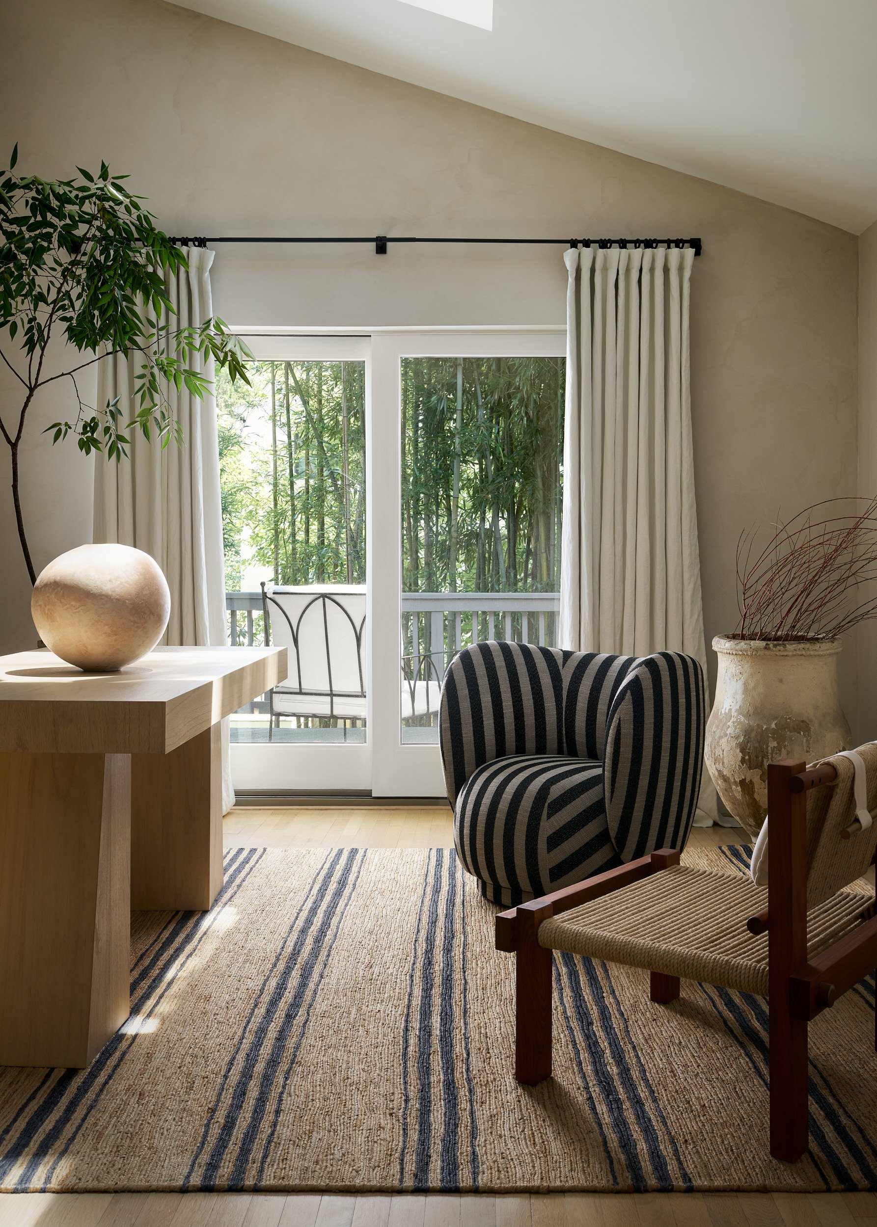 Sunroom with French doors and a striped area rug, interior design photography in Maryland