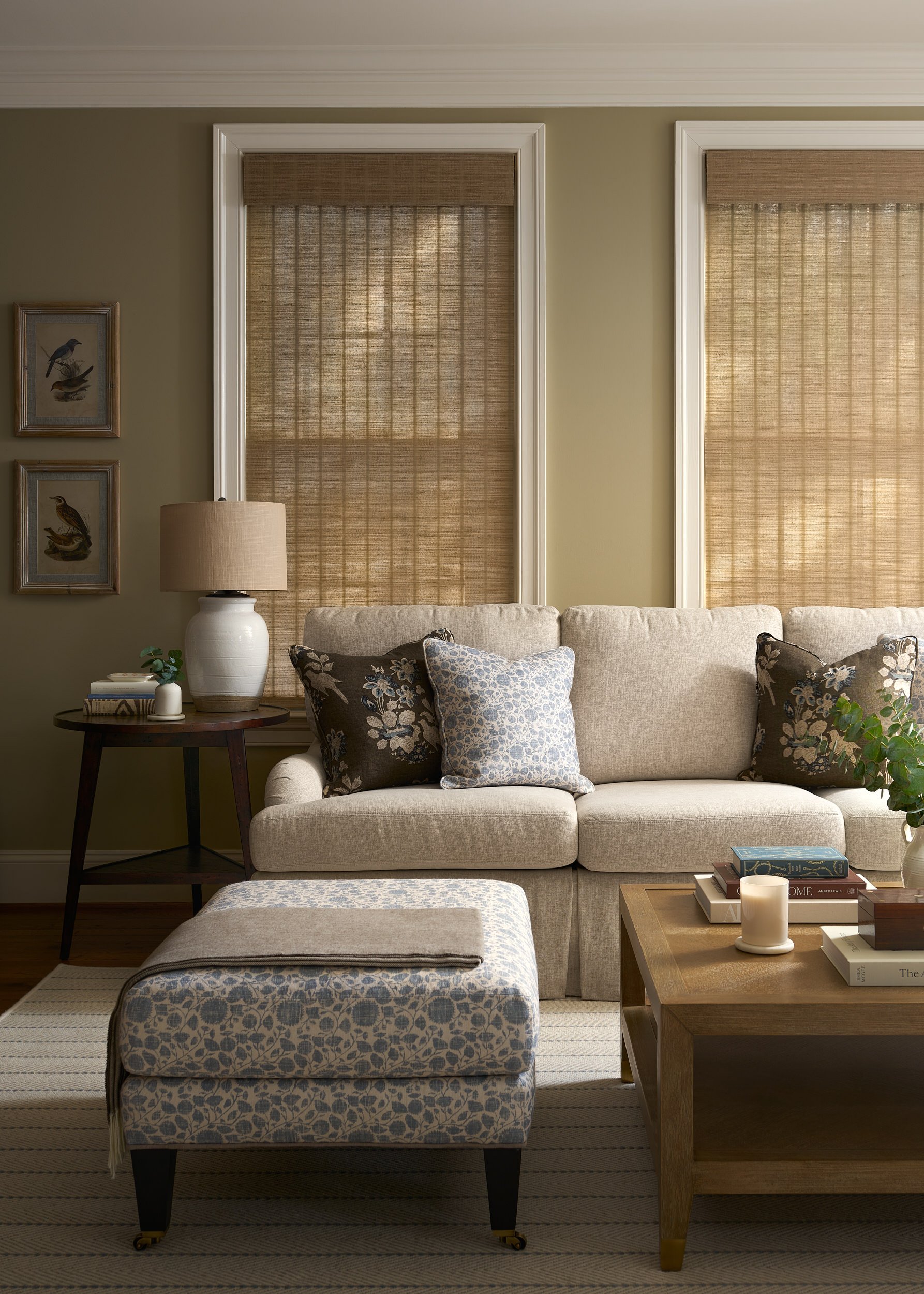 Living room with a neutral sofa and woven roman shades, interior design photography in Maryland