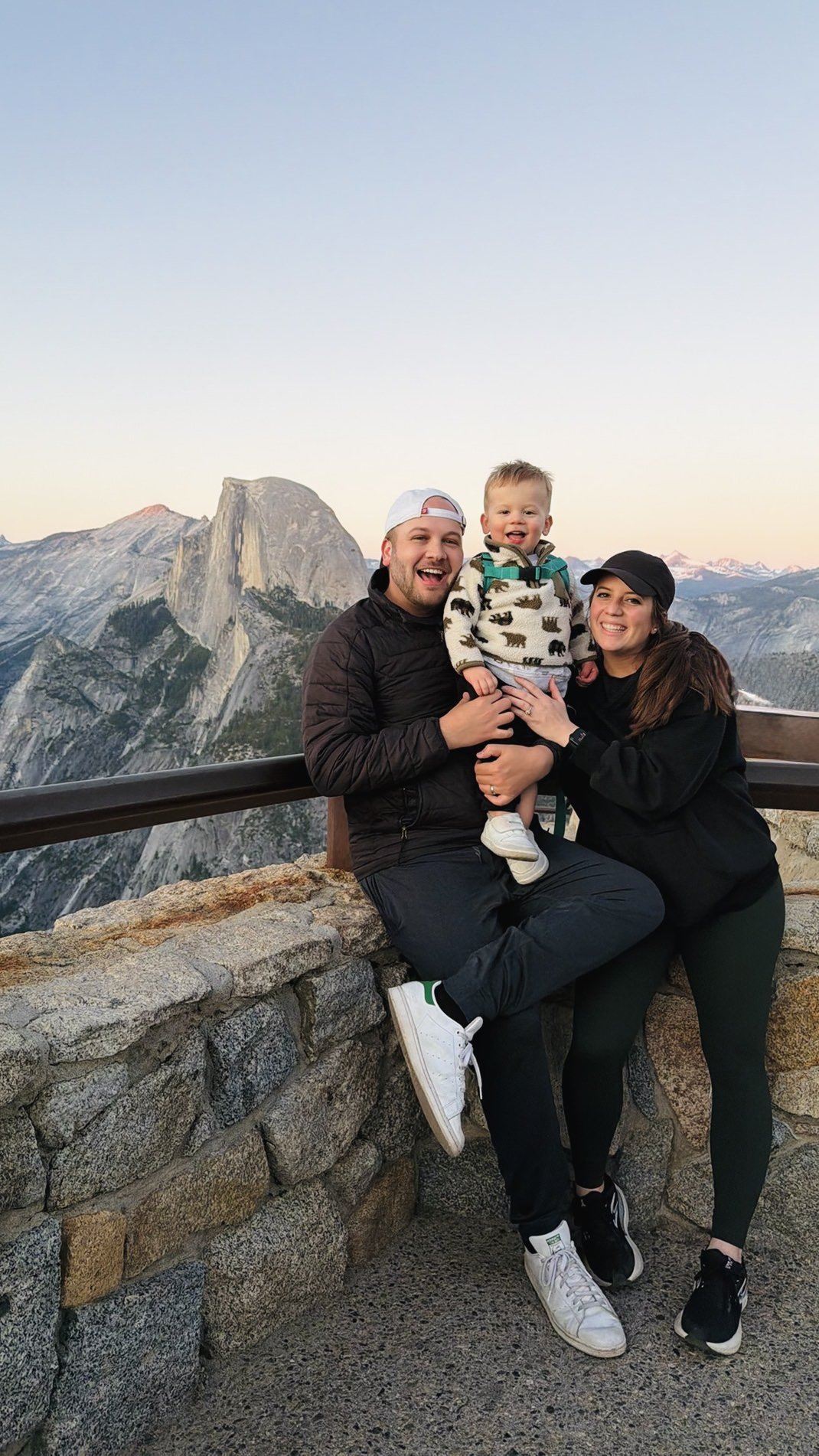 Ian Michelman with his wife and son at a mountain overlook in Yosemite National Park.