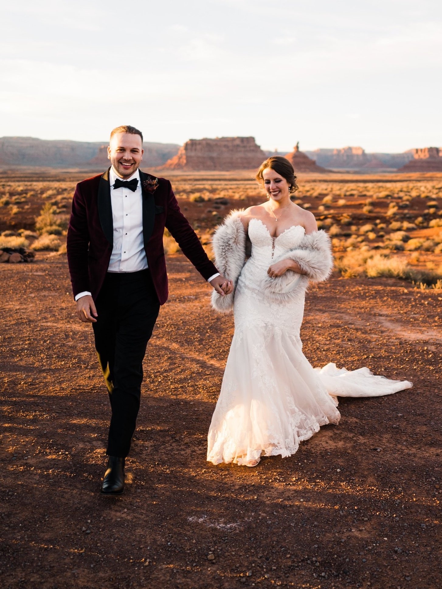 Ian Michelman and his wife walking hand-in-hand at their Southern Utah elopement.
