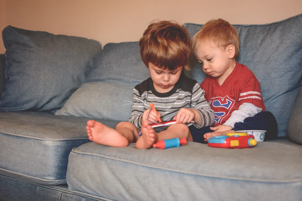 letting little brother peek over his shoulder while he draws- definitely the 3 year old version of "i love you".