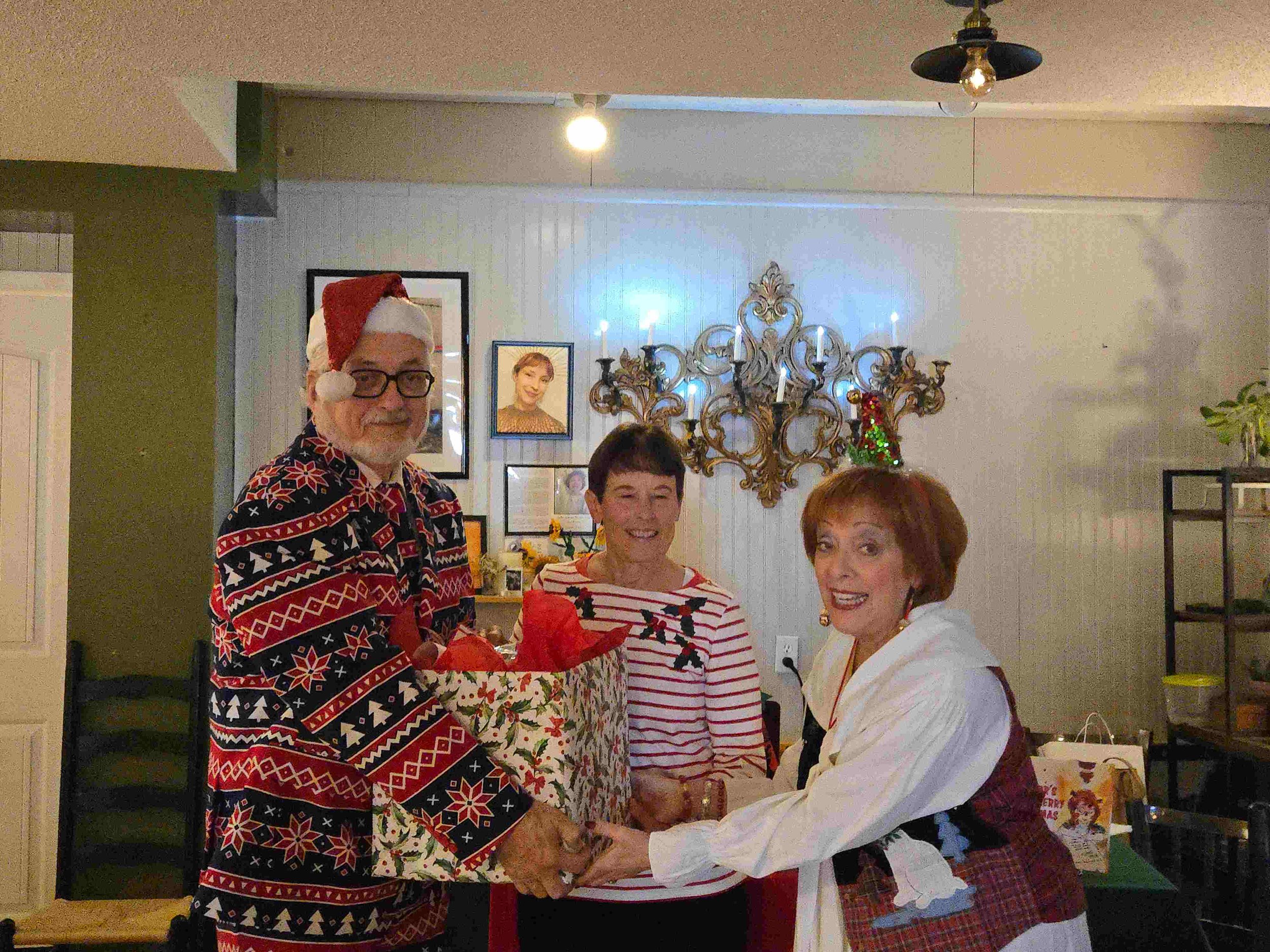 Judy and Bernie donate box to Sue.jpg