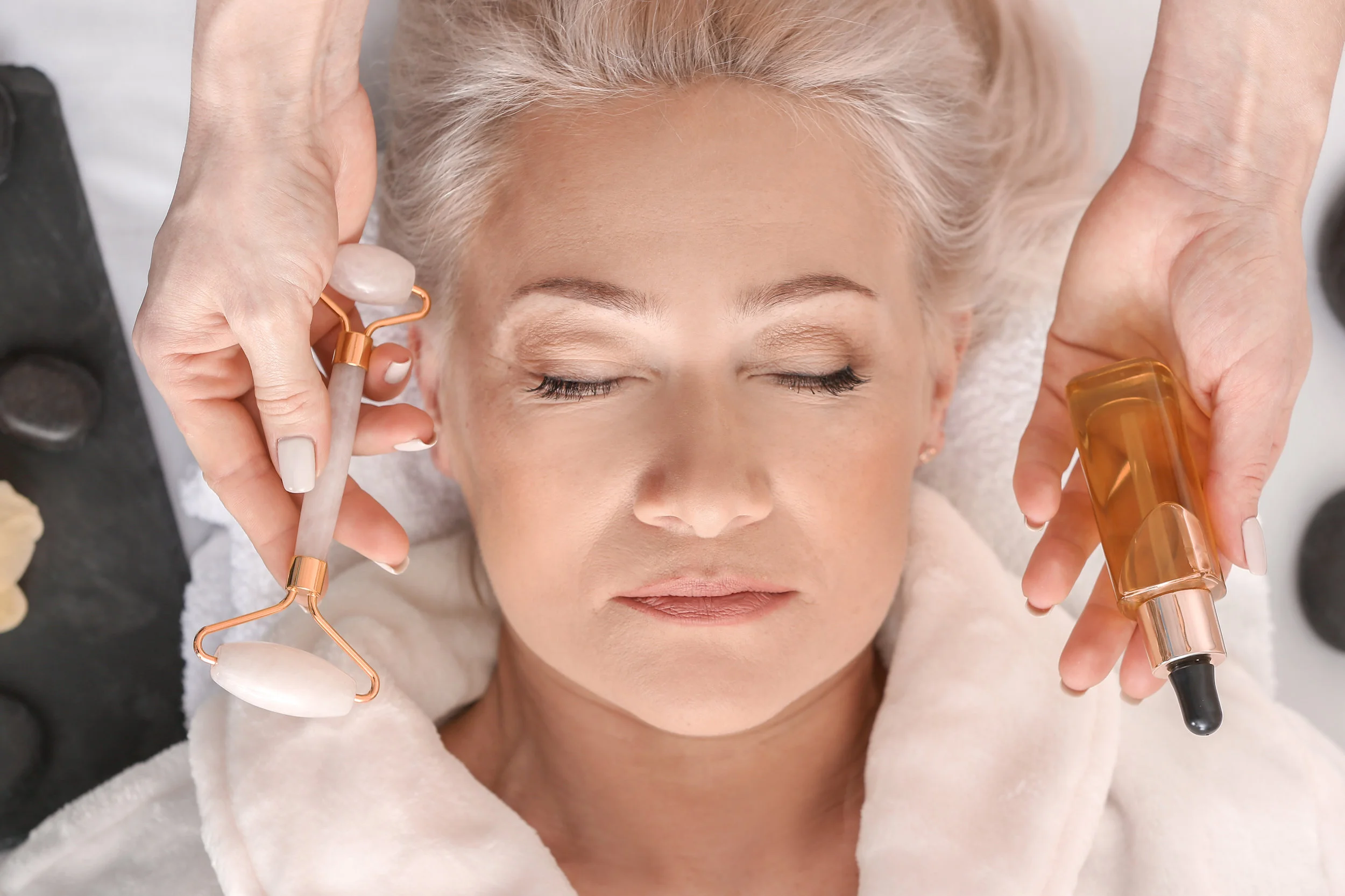 Mature woman undergoing treatment in beauty salon