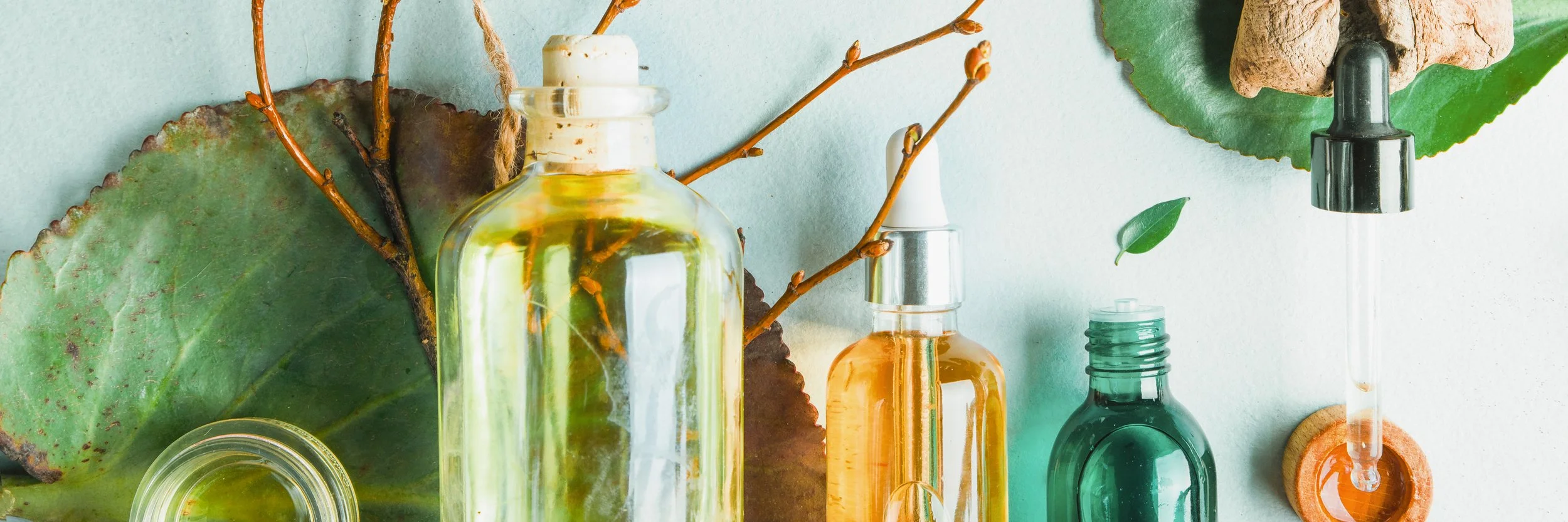 Homeopathic oils, dietary supplements for intestinal health Natural cosmetics, oils for skin care on a light background. (Copy)