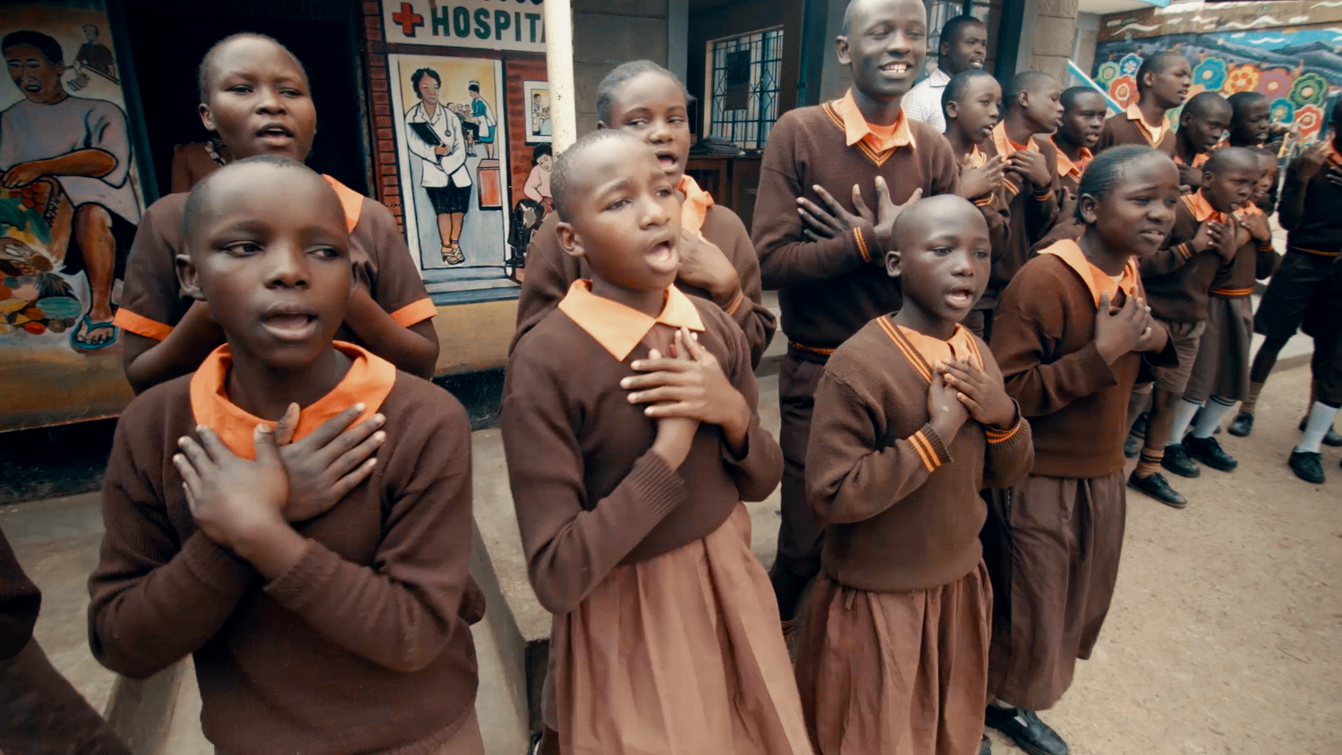 Children+Singing+at+Magoso+Primary+School+in+Kibera+Slum+-+Screenshot+from+Film.png