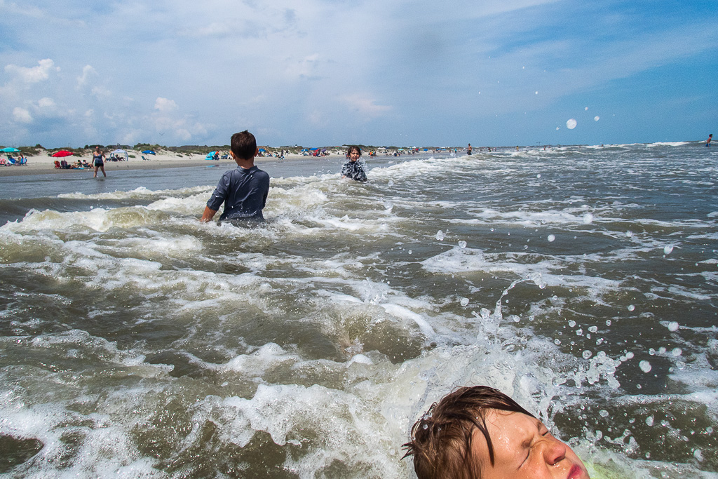 brothers-swim-ocean-waves.jpg