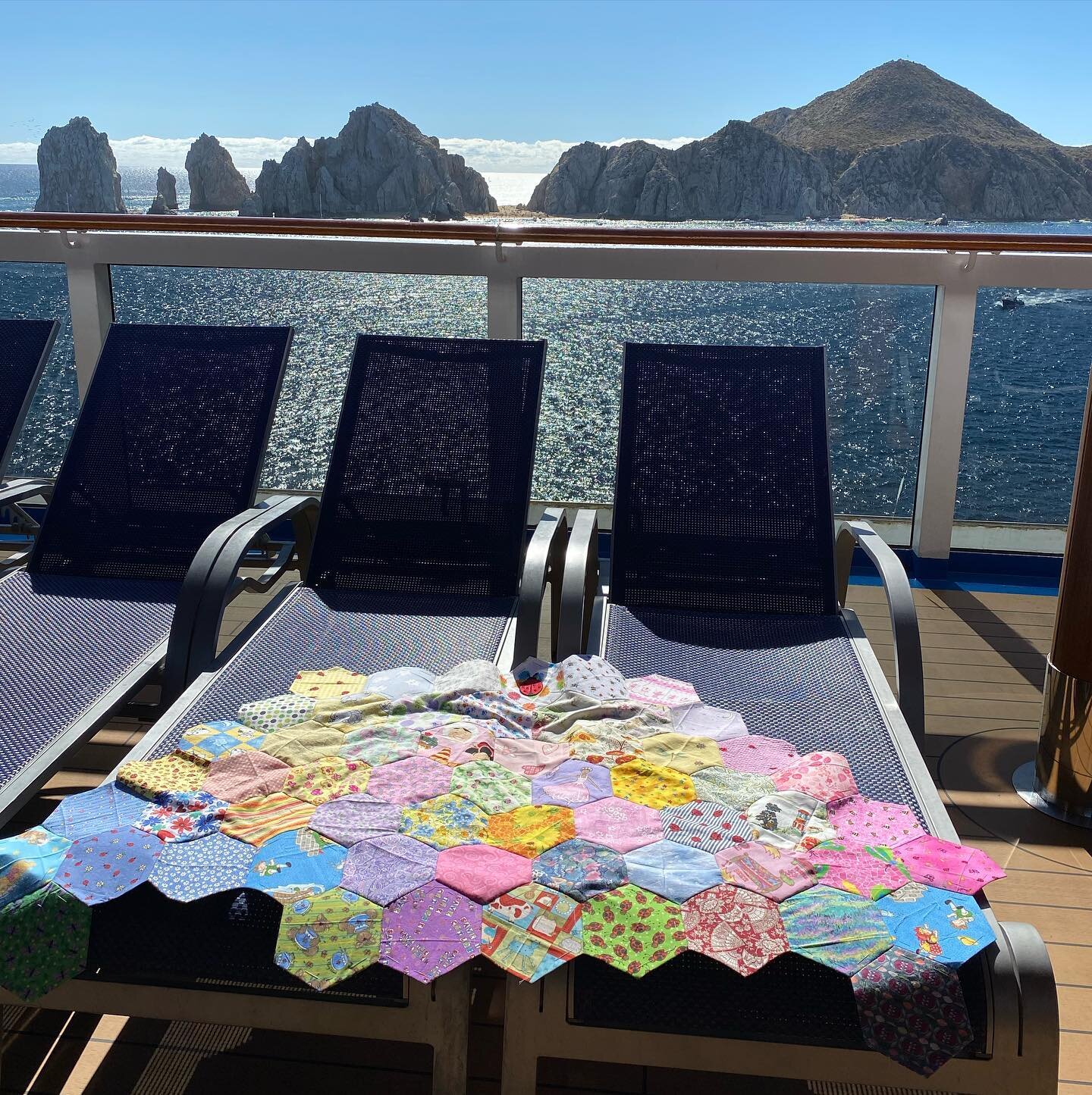 #hexiquilt ing in Cabo on the ship. Beautiful day and I&rsquo;m over halfway done making this giant hexagon out of small hexagons.  Labor of love. #babyquilt