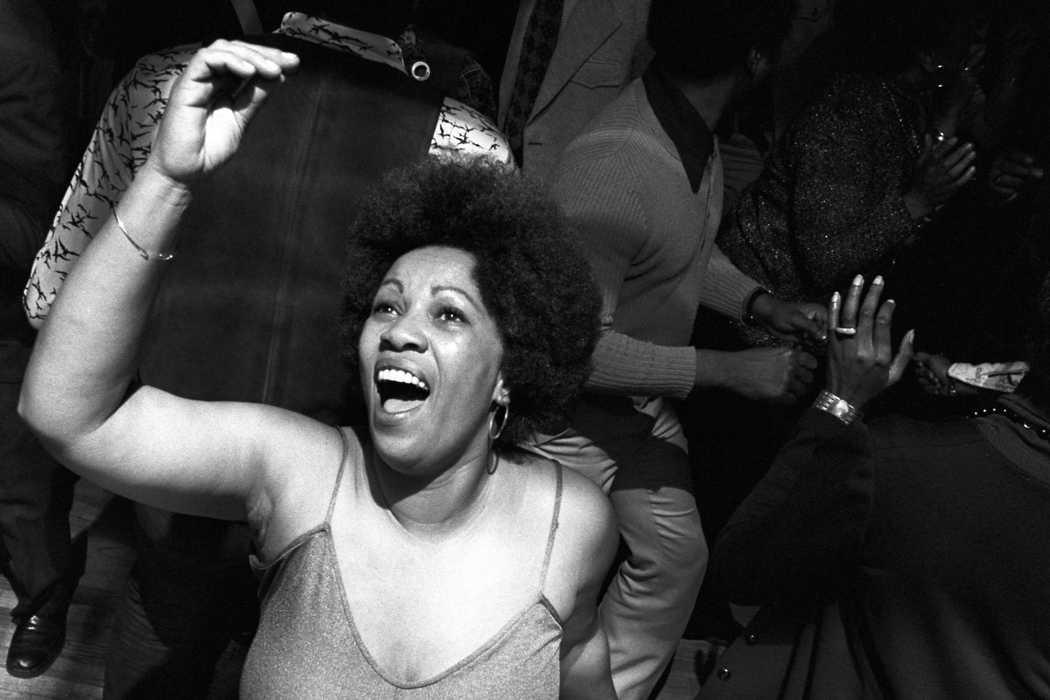 Toni getting her life and delivering us at a New York disco, 1974. 