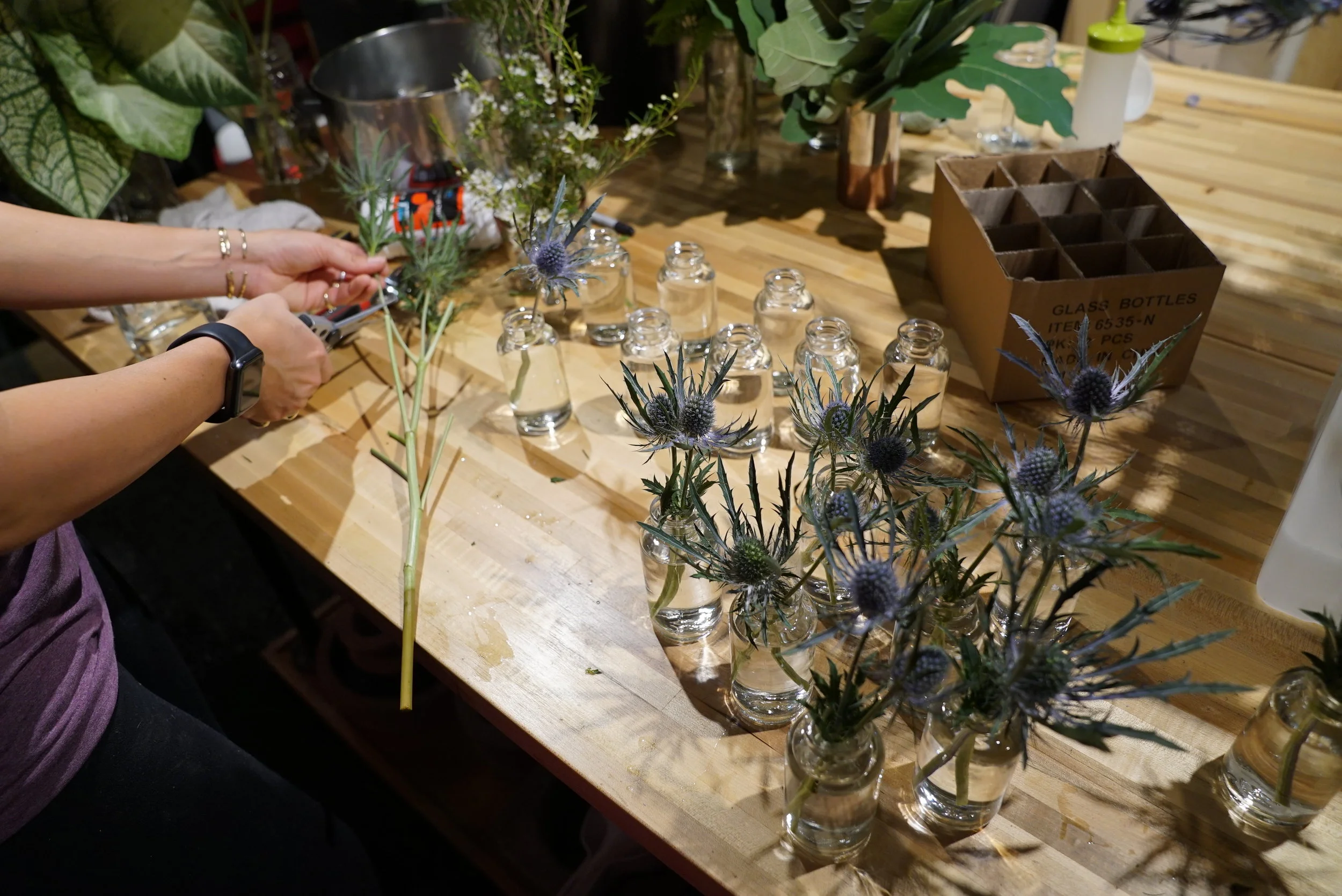  Prepping lots, and lots, and lots, and lots of tiny bottles for the table decorations. 