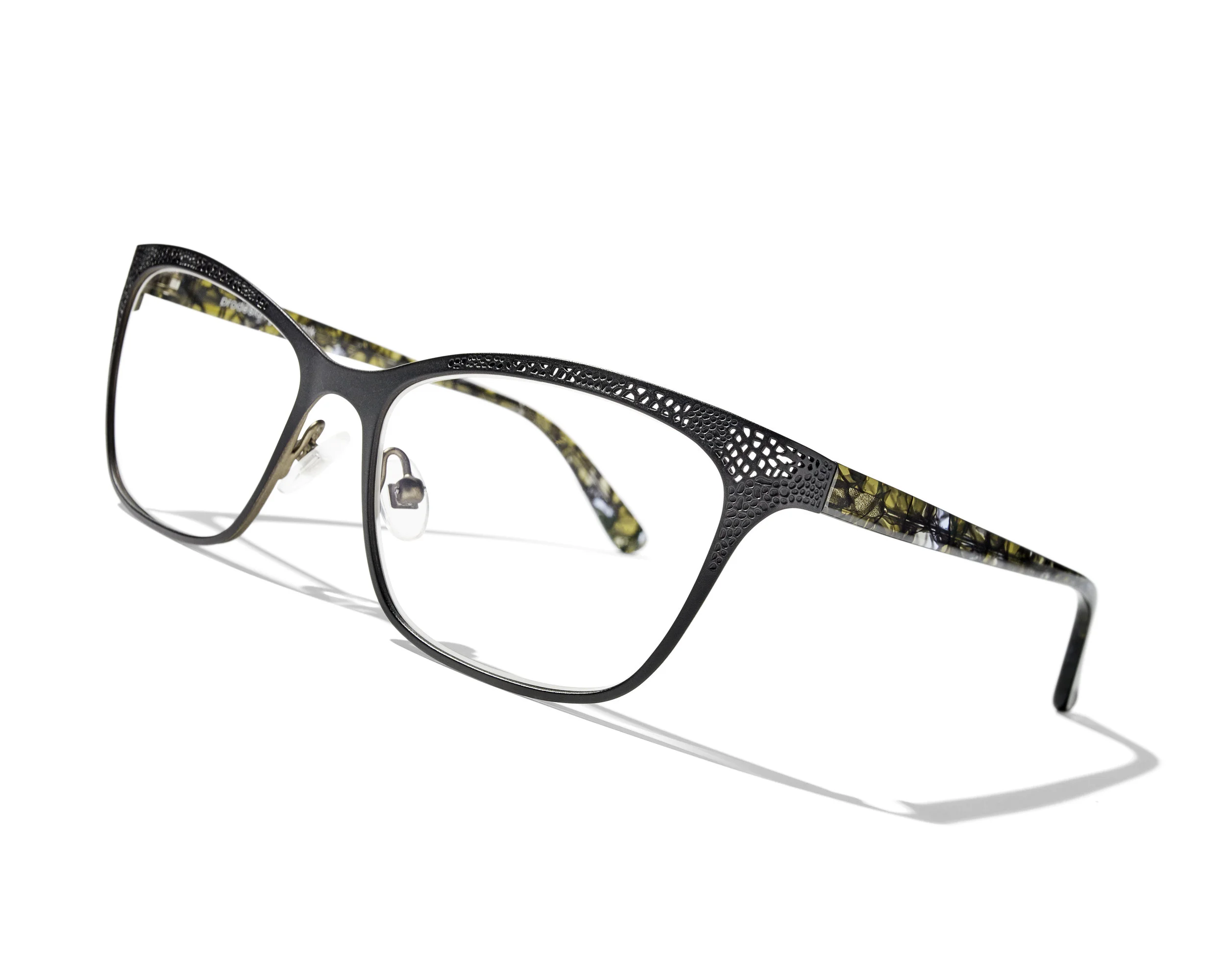 LASTING LACE Enjoy the whisper of lacy lingerie in the fine cutout pattern on these two feminine frames: the almond shape is a discreet cat eye shape , while the bolder rectangular shape makes a more powerful statement. The deep metal colours on the front are paired with vivid colours on the inside, and perfectly matched tortoiseshell effects on the temples.