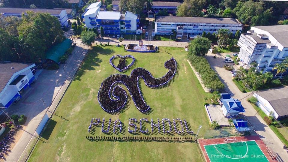 The students spent weeks practicing this formation. It is the Thai number "9" with a black ribbon with a heart around it to pay respects to the late King who passed October 13, 2016.