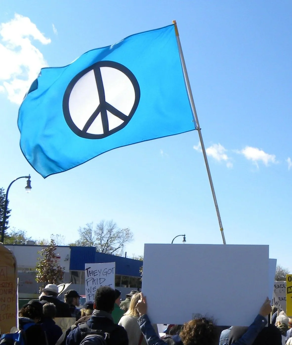 People at a march with peace flag