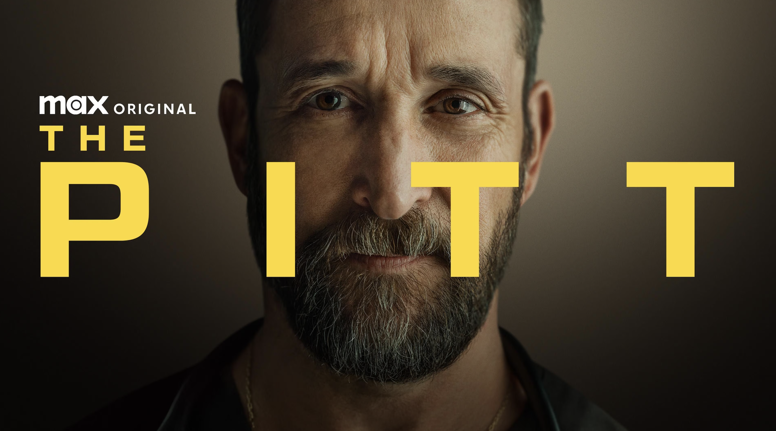 A pensive man with a beard gazes forward in dim lighting. Bold yellow text reads "Max Original: The Pitt," with a serious and mysterious tone.