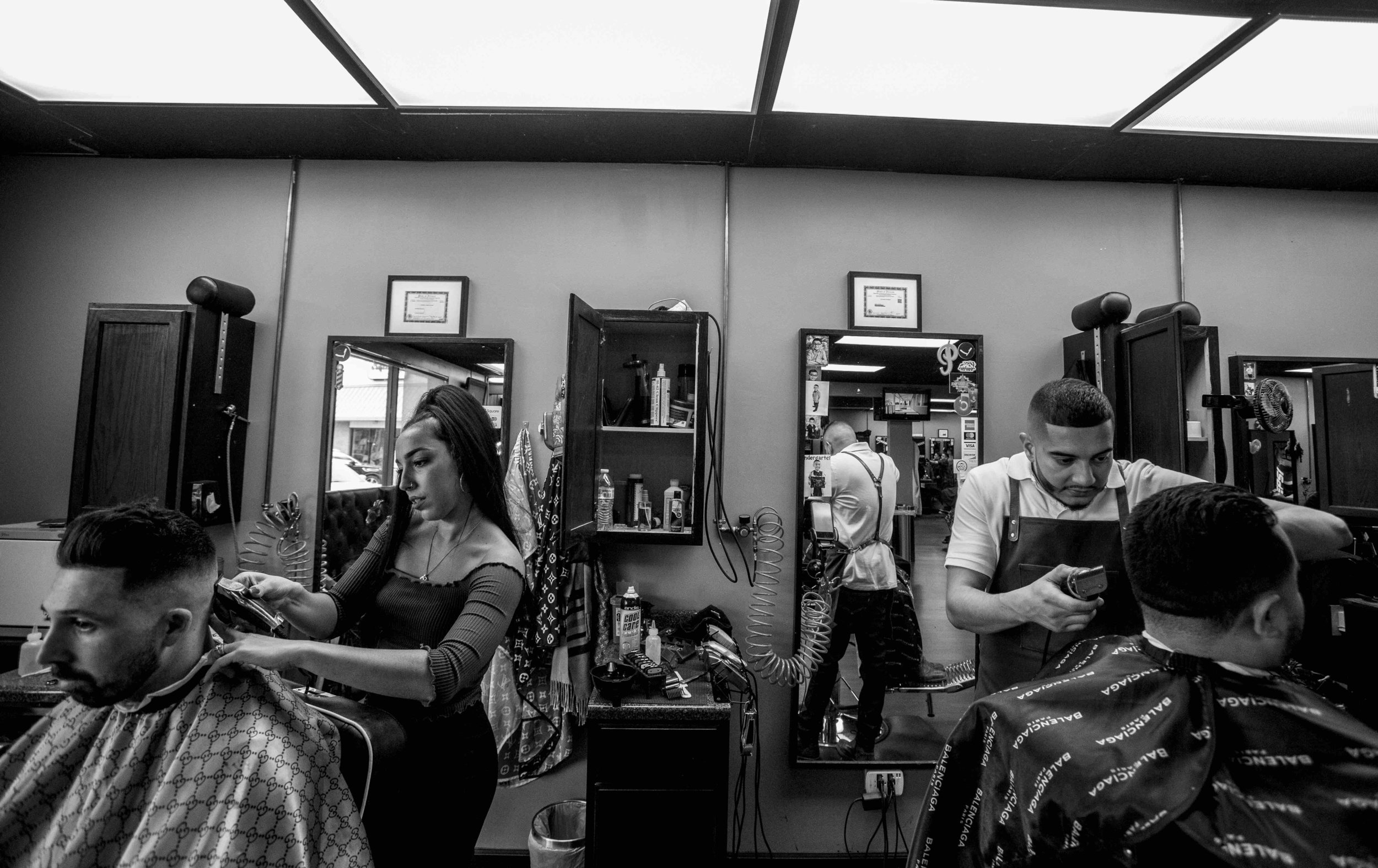 His shop is a platinum trombone to his community. Born and raised in the Latino-Chicago village, he began cutting hair during his teenage years, and that’s when everyone started knowing his name. “Growing up in a lower income family. I couldn’t afford to get a haircut, so I learned how to cut my own hair. Then my friends wanted me to cut their hair and I realized, I was a barber. My first goal was to become a licensed barber. I’m platinum now.”