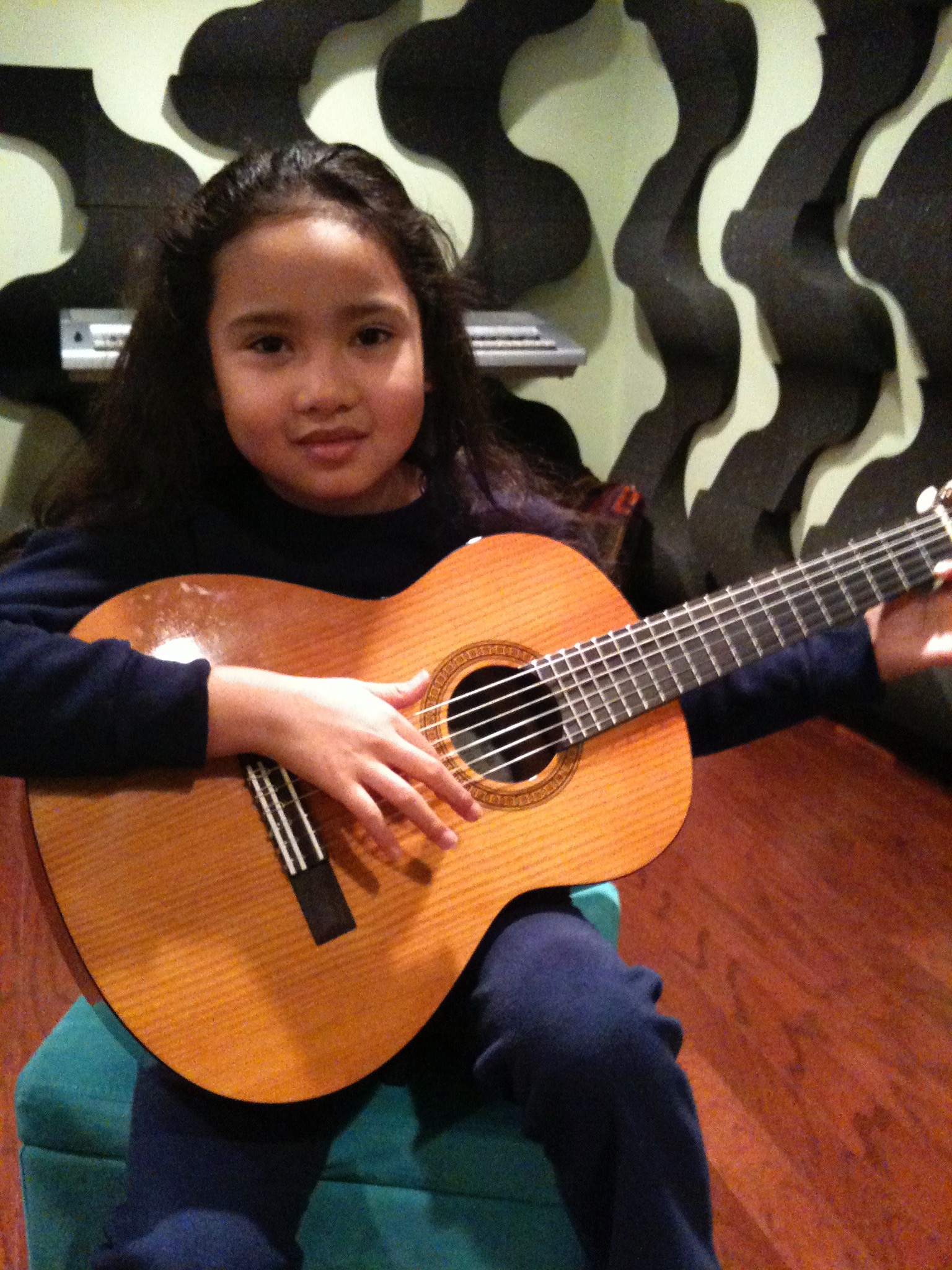 7 and a half years old playing guitar.jpg