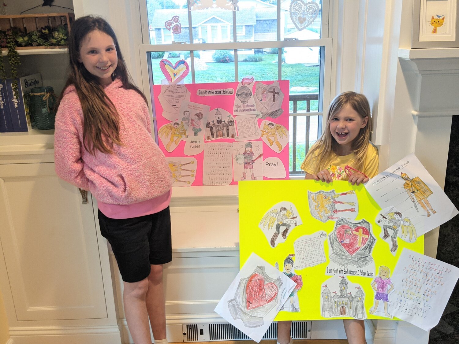 Emma and Hailey show off their craft completed during online Sunday School (2020-21 school year)