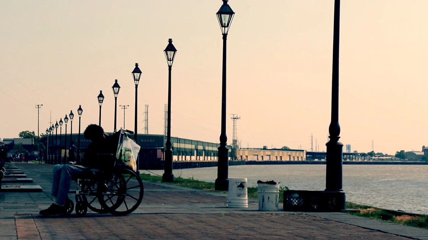 The+gas+light+district+in+New+Orleans,+a+sillouette+of+a+wheelchair+rider+waiting.jpeg