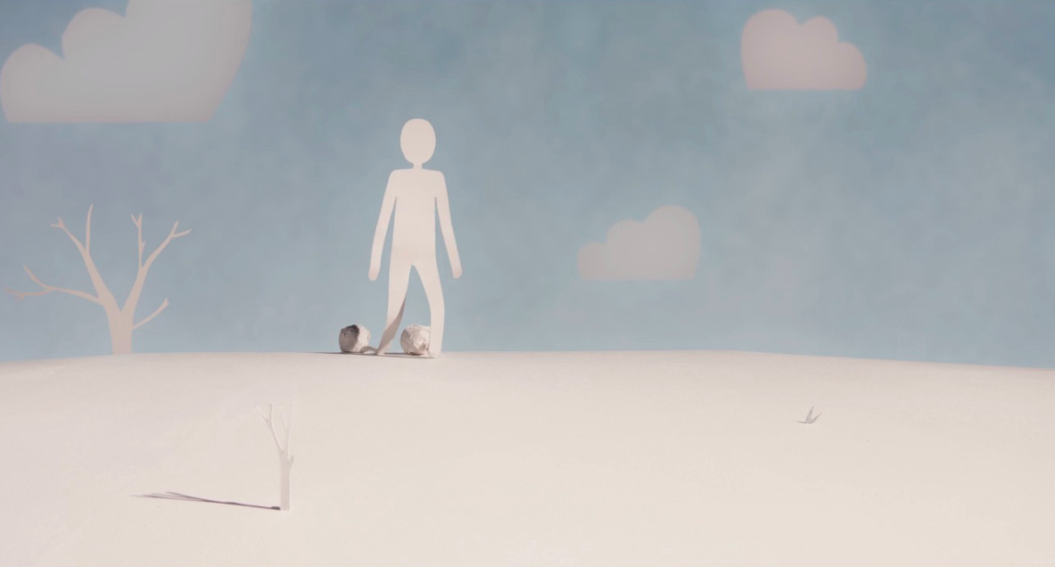 A human-like figure cut from a blank sheet of paper stands alone with wrinkled paper at their feet. A couple of paper trees are next to them.