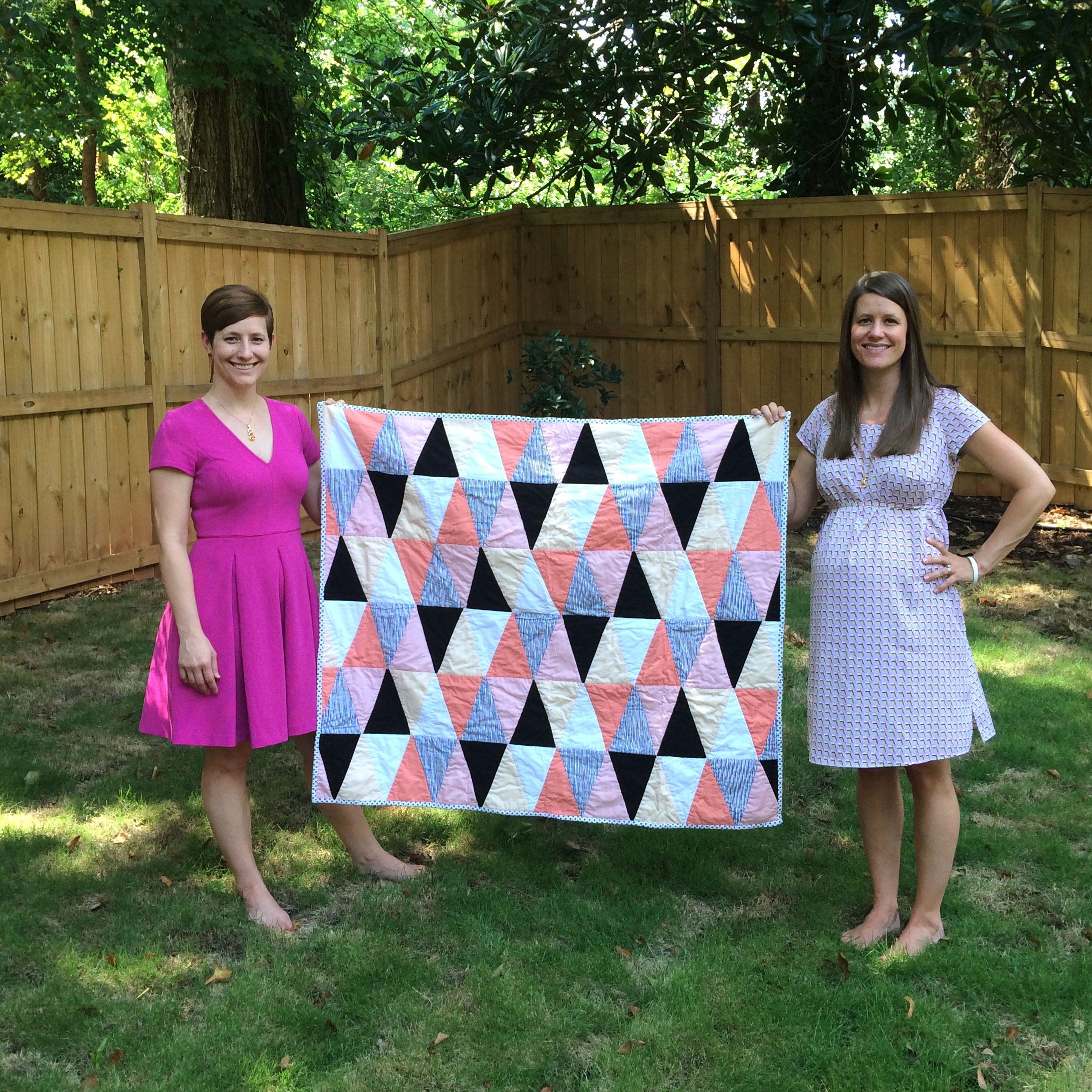 Me and my sister Kate holding my first quilt