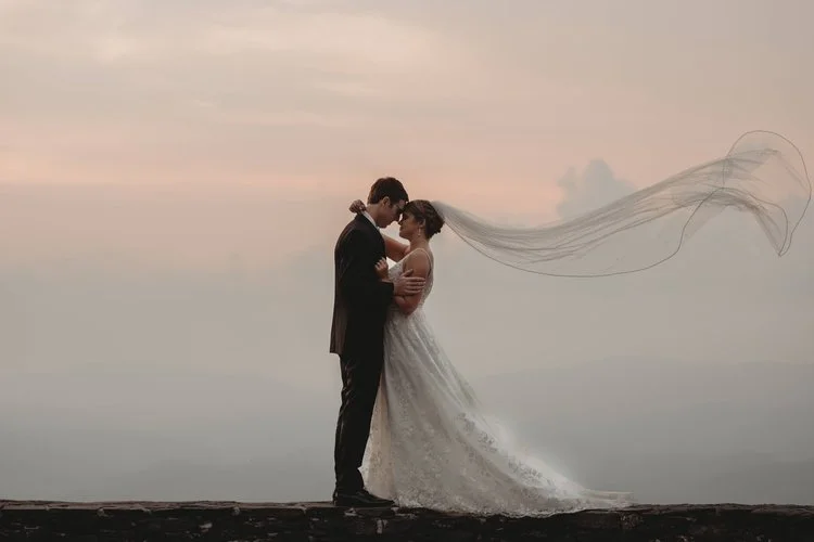 mountain-elopement-couple-kiss-wind-blown-veil