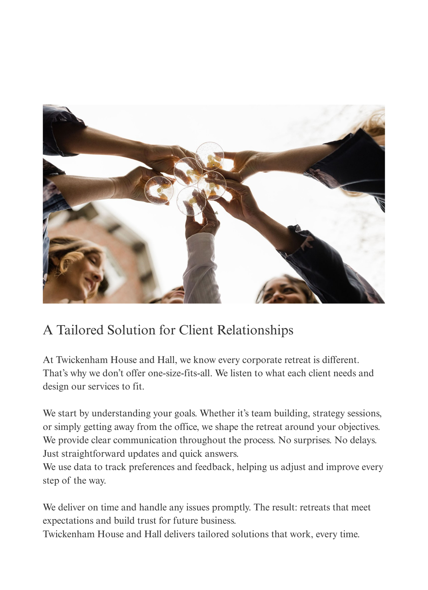 Corporate retreat team clinking wine glasses in a celebratory toast, hands raised together at Twickenham House and Hall