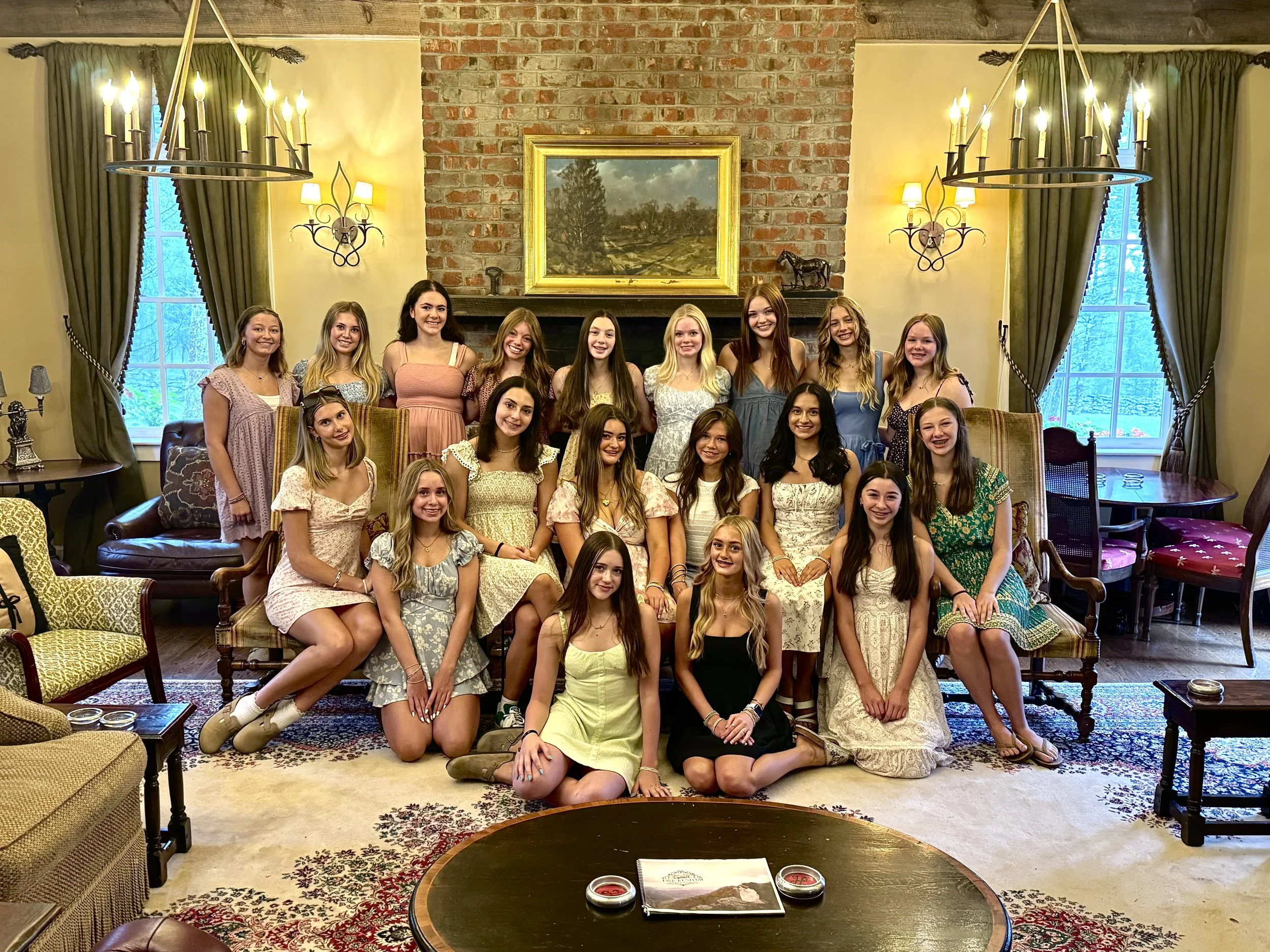 Group portrait of women in a living room at an estate during a wedding weekend gathering