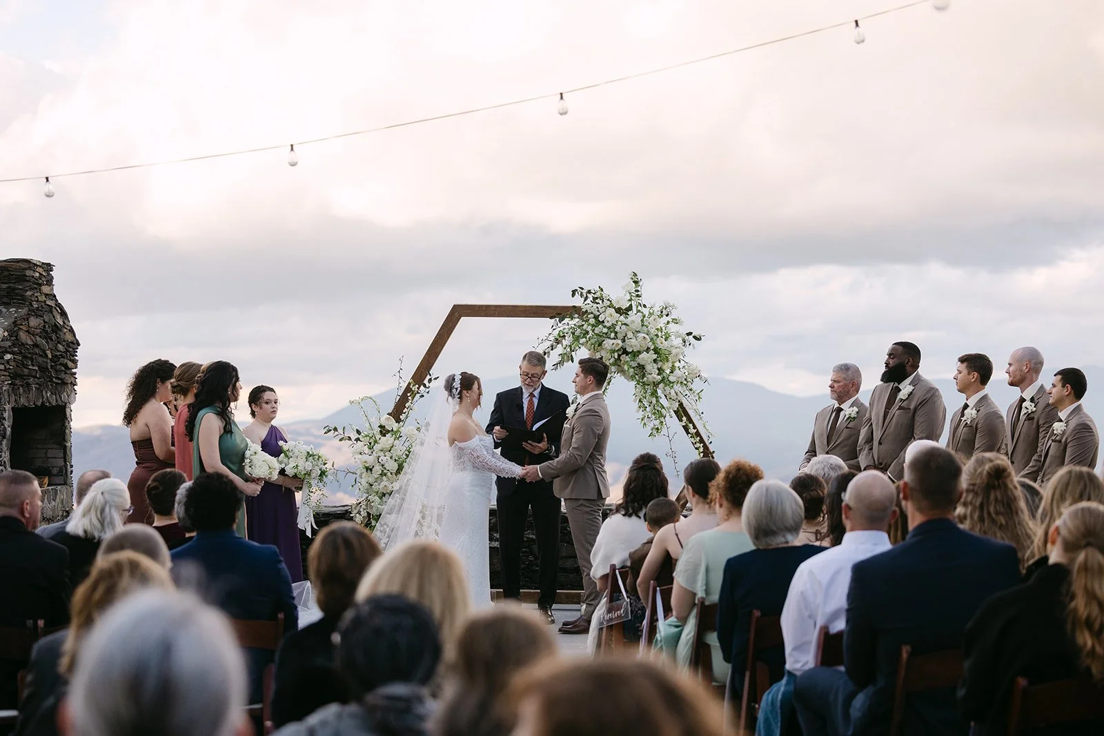 mountain-overlook-ceremony-with-wooden-floral-arch.jpg
