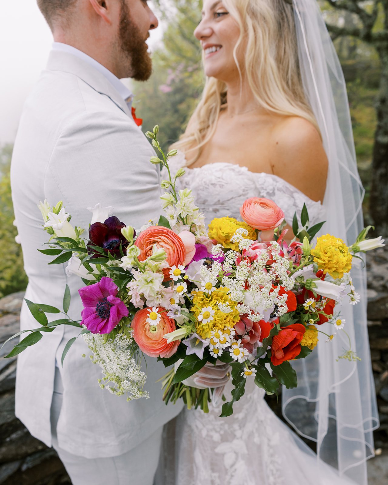 bride-groom-portrait-colorful-wildflower-bouquet