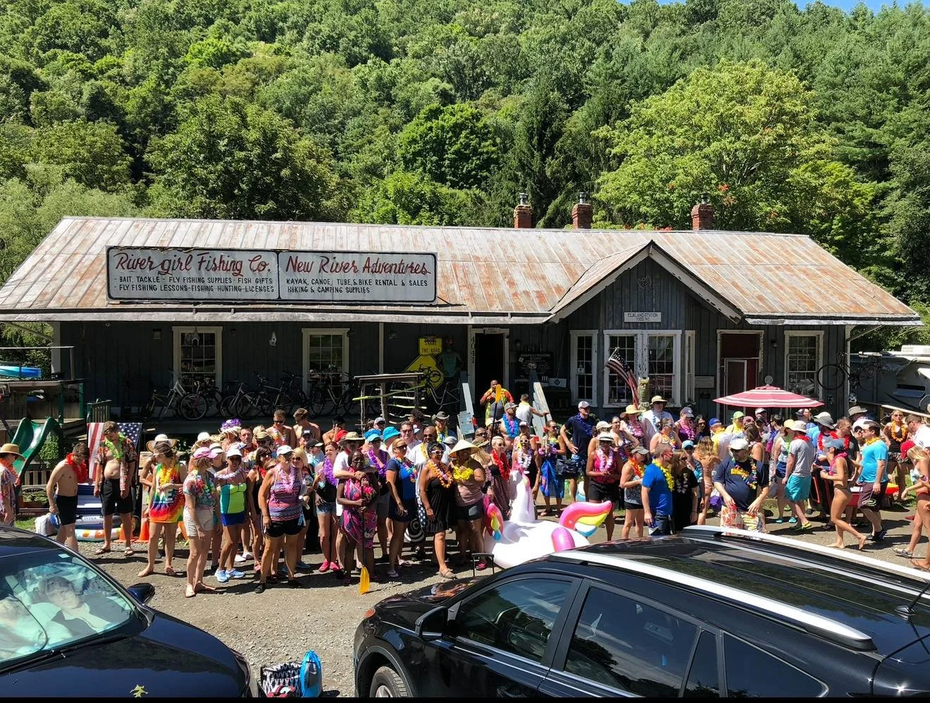 Crowd gathered outside Wahoos Adventures outpost on a busy summer day