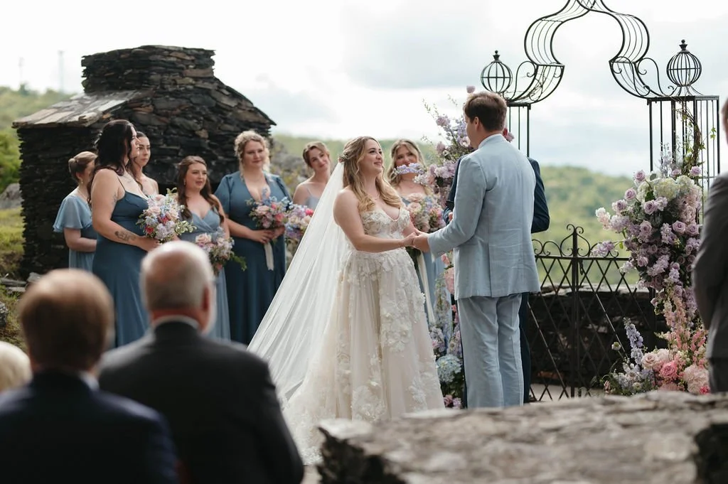 mountain-overlook-wedding-ceremony-with-blue-bridal-party.jpg